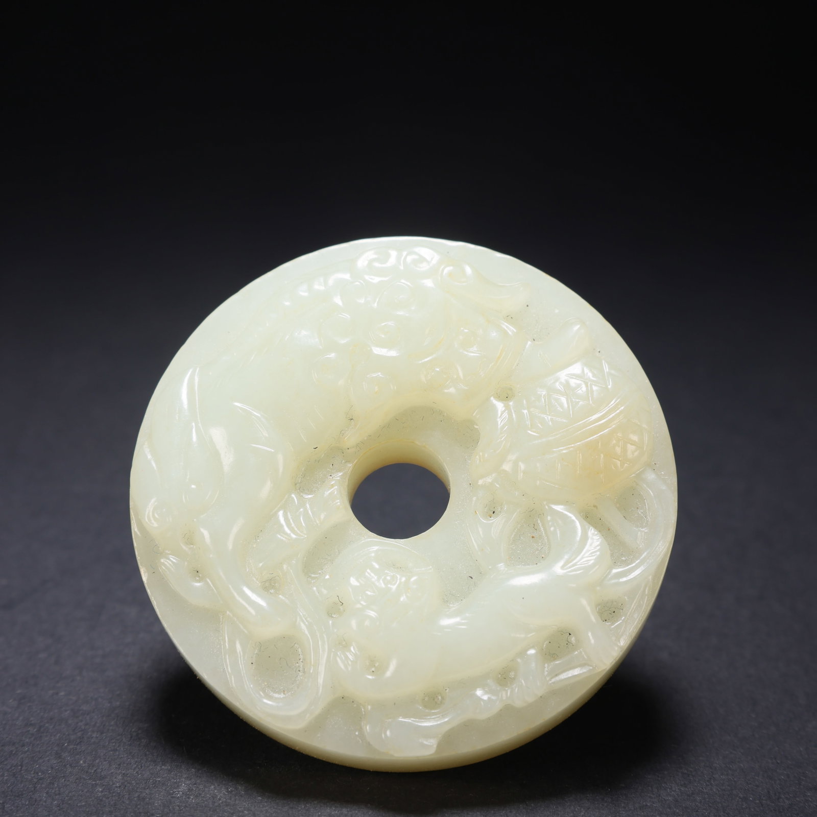 A HETIAN JADE BEAST-FACE PENDANT: Hetian Jade Beast-Face Pendant
