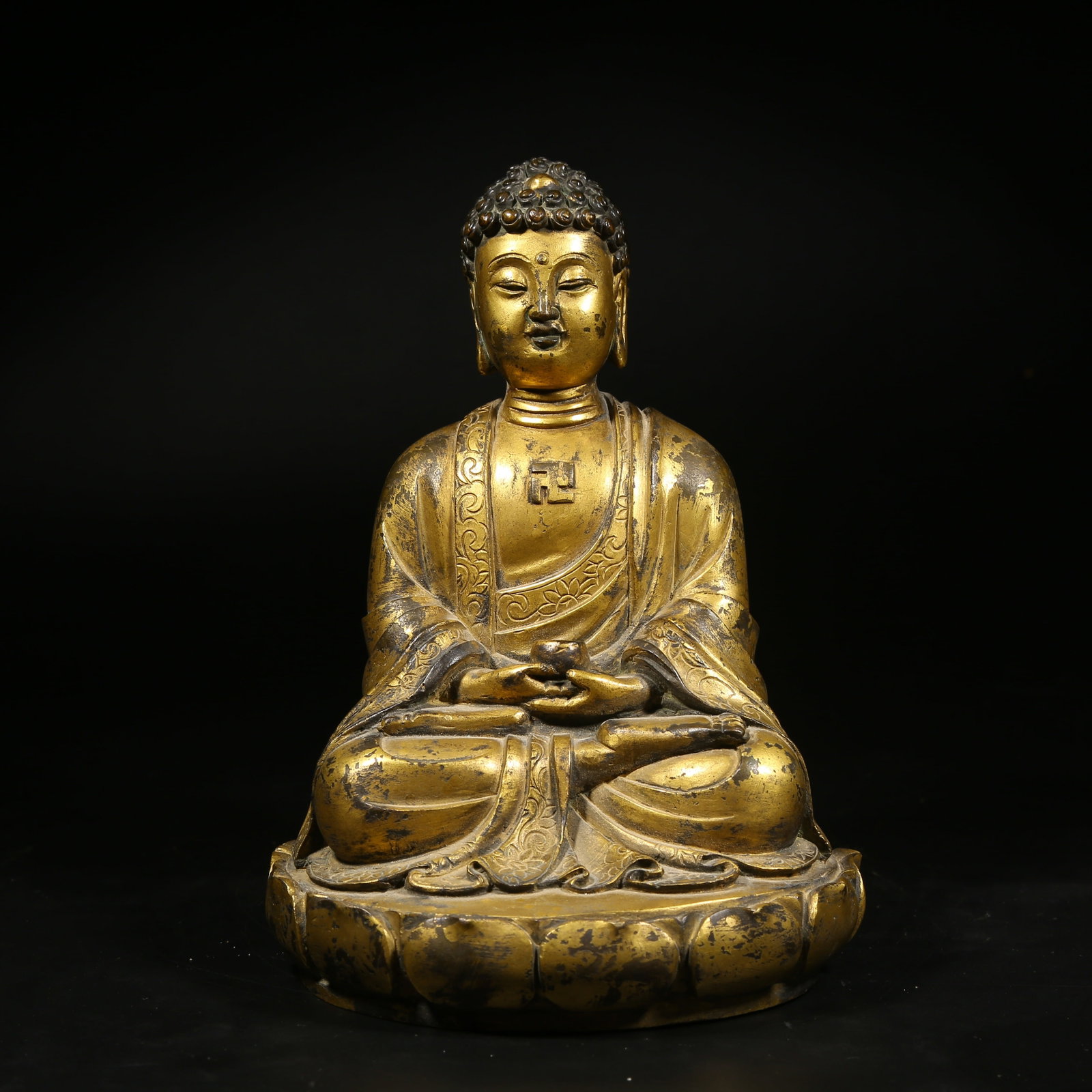 A GILDED BRONZE STATUE OF SHAKYAMUNI BUDDHA: Gilded Bronze Statue of Shakyamuni Buddha
