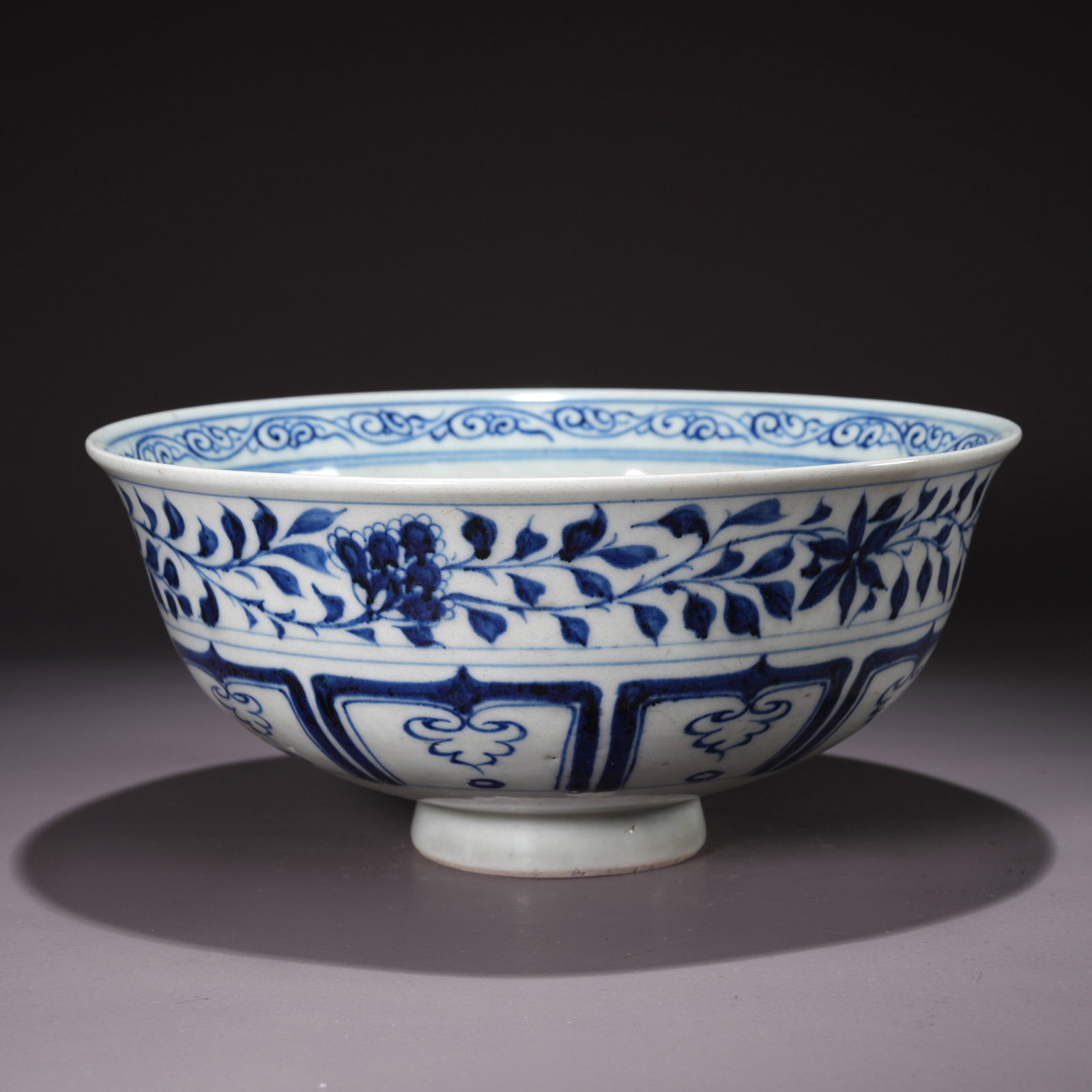 A BLUE-AND-WHITE BOWL WITH LIANHUA FLOWER MOTIFS: Blue-and-White Bowl with Lianhua Flower Motifs