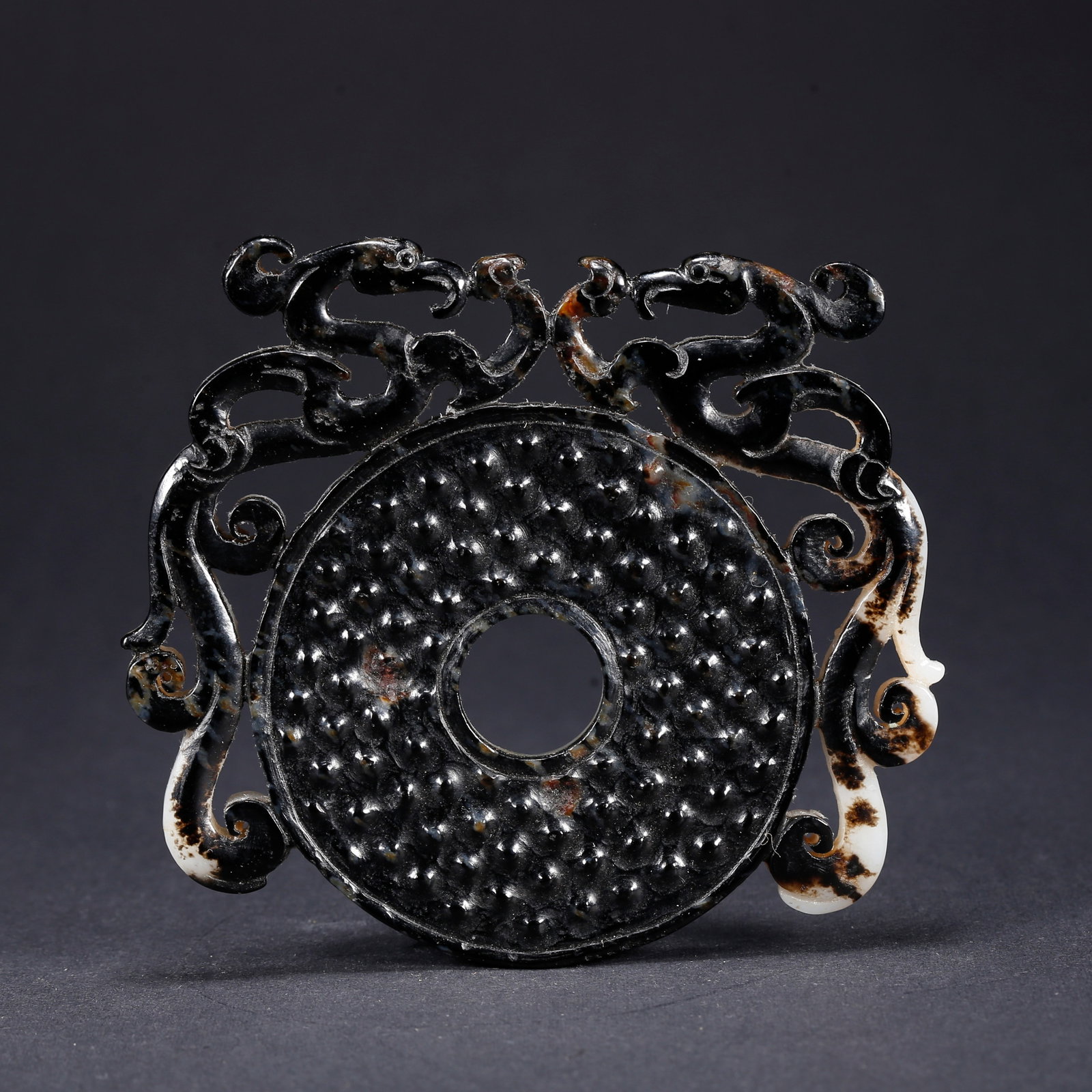 A HETIAN JADE BI DISC WITH BOSS PATTERN (1 of 9)
