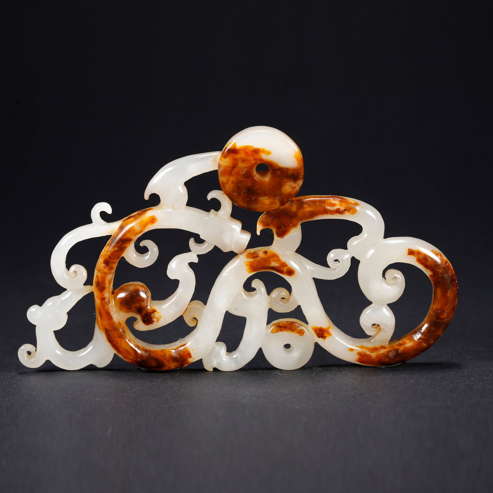 A HETIAN JADE DRAGON AND PHOENIX FIGURINE (1 of 10)