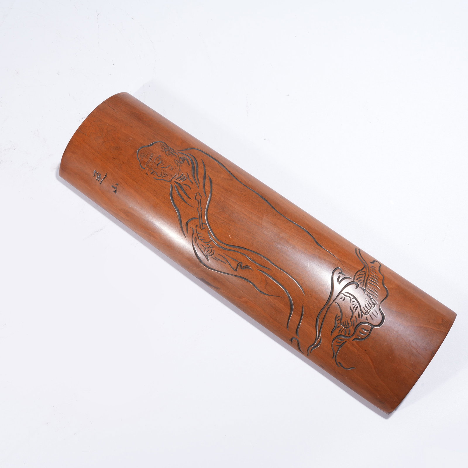A ARMREST WITH ARHAT MOTIF IN HUANGHUALI WOOD: Armrest with Arhat Motif in Huanghuali Wood