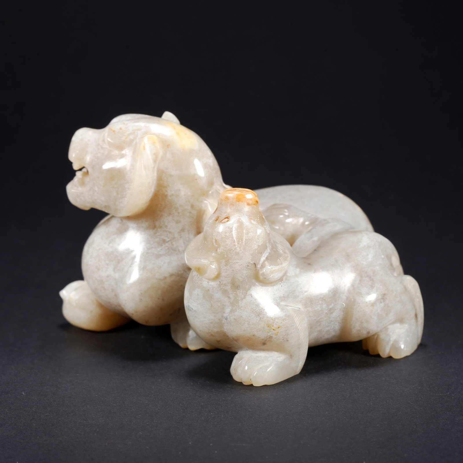 A HETIAN JADE BEAST-SHAPED FIGURINE: Hetian Jade Beast-Shaped Figurine