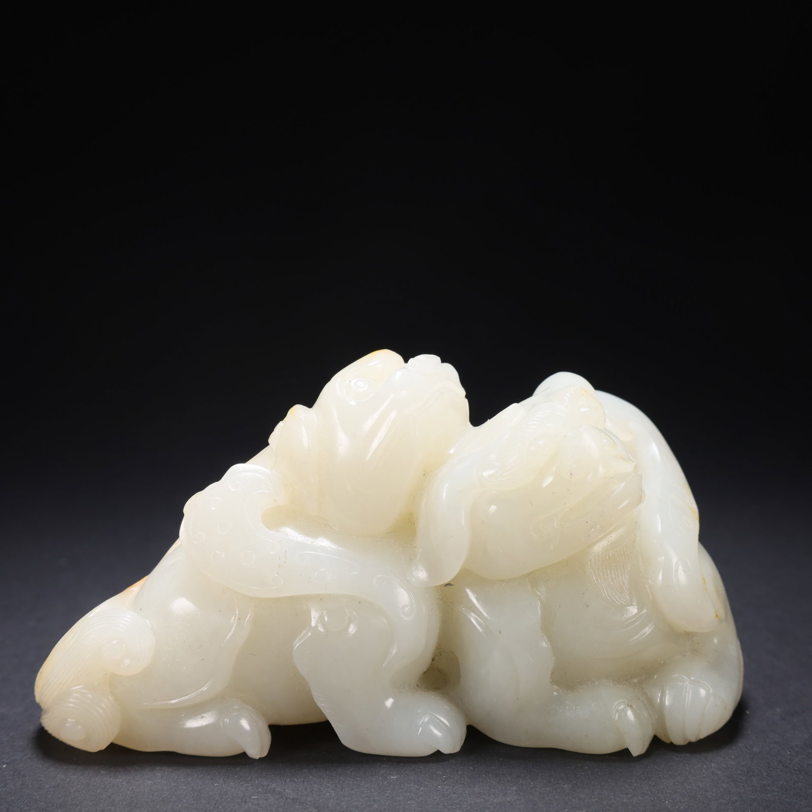 A HETIAN JADE DOUBLE-BEAST FIGURINE: Hetian Jade Double-Beast Figurine