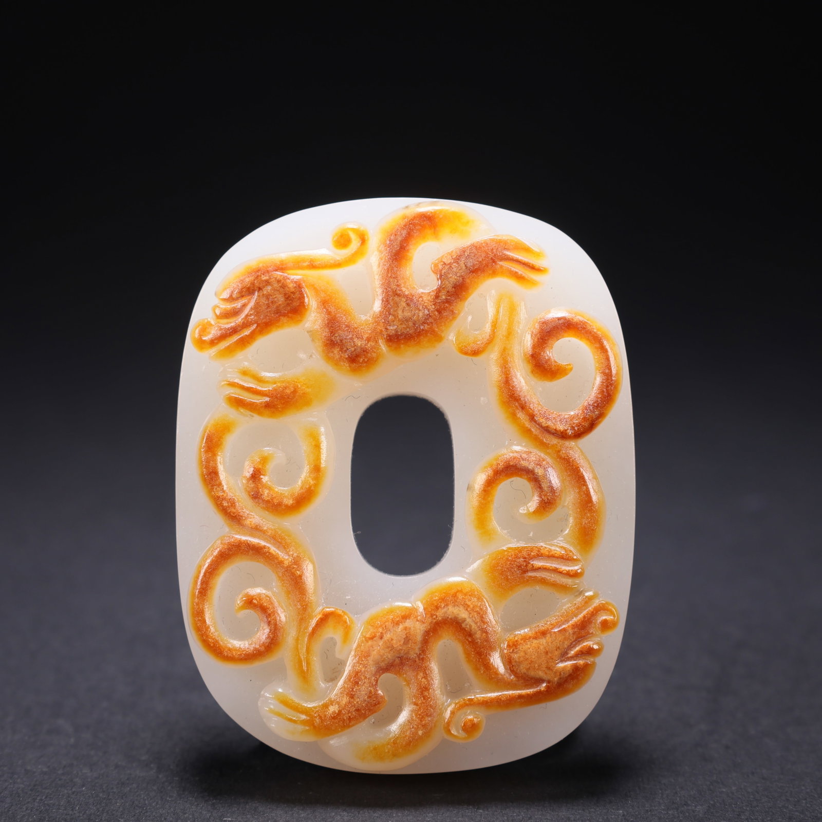 A HETIAN JADE POLYCHROME DOUBLE-DRAGON BI DISK (1 of 9)