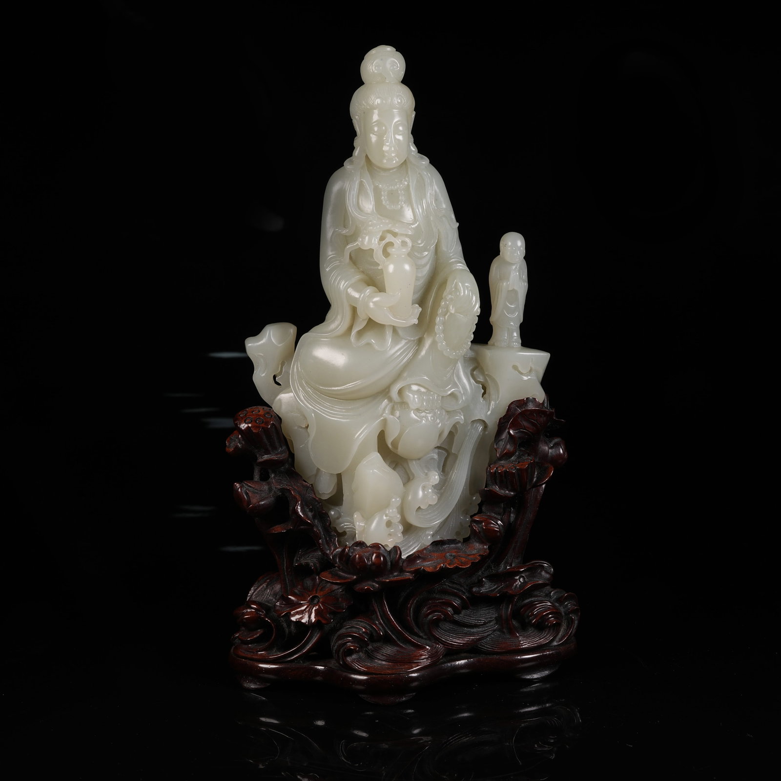 A HETIAN JADE STATUE OF VASE HOLDING GUANYIN (1 of 9)