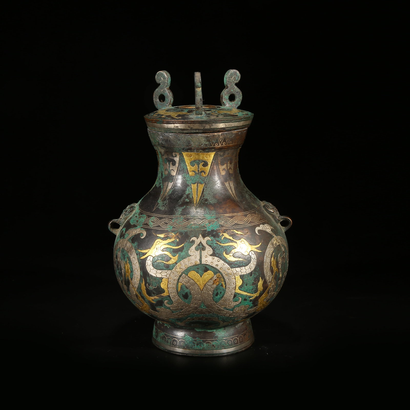A GILT AND SILVER INLAID BRONZE EWER WITH ANIMAL-HEAD SPOUT: Gilt and Silver Inlaid Bronze Ewer with Animal-Head Spout