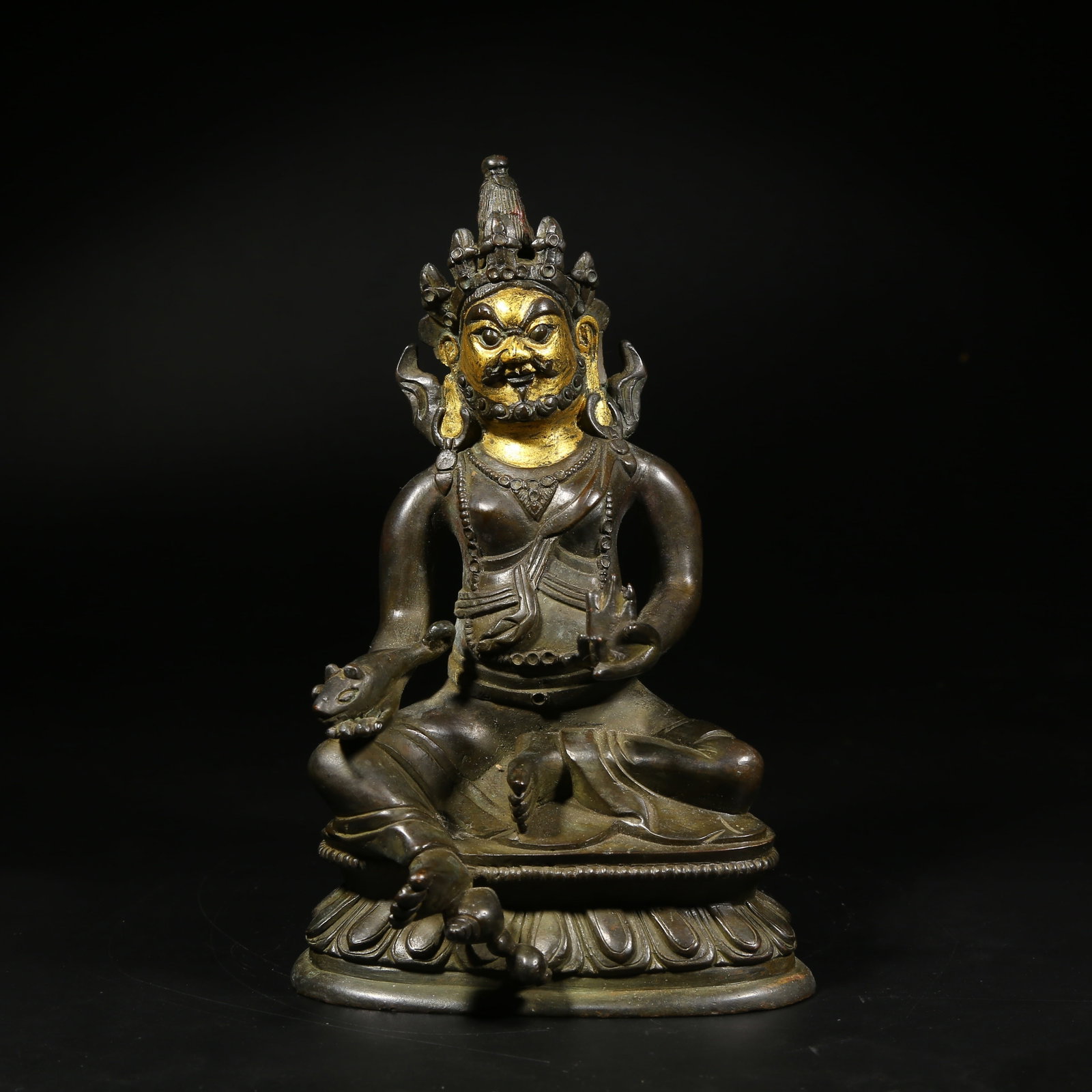 A PARTIALLY GILDED BRONZE STATUE OF THE YELLOW JAMBHALA: Partially Gilded Bronze Statue of the Yellow Jambhala