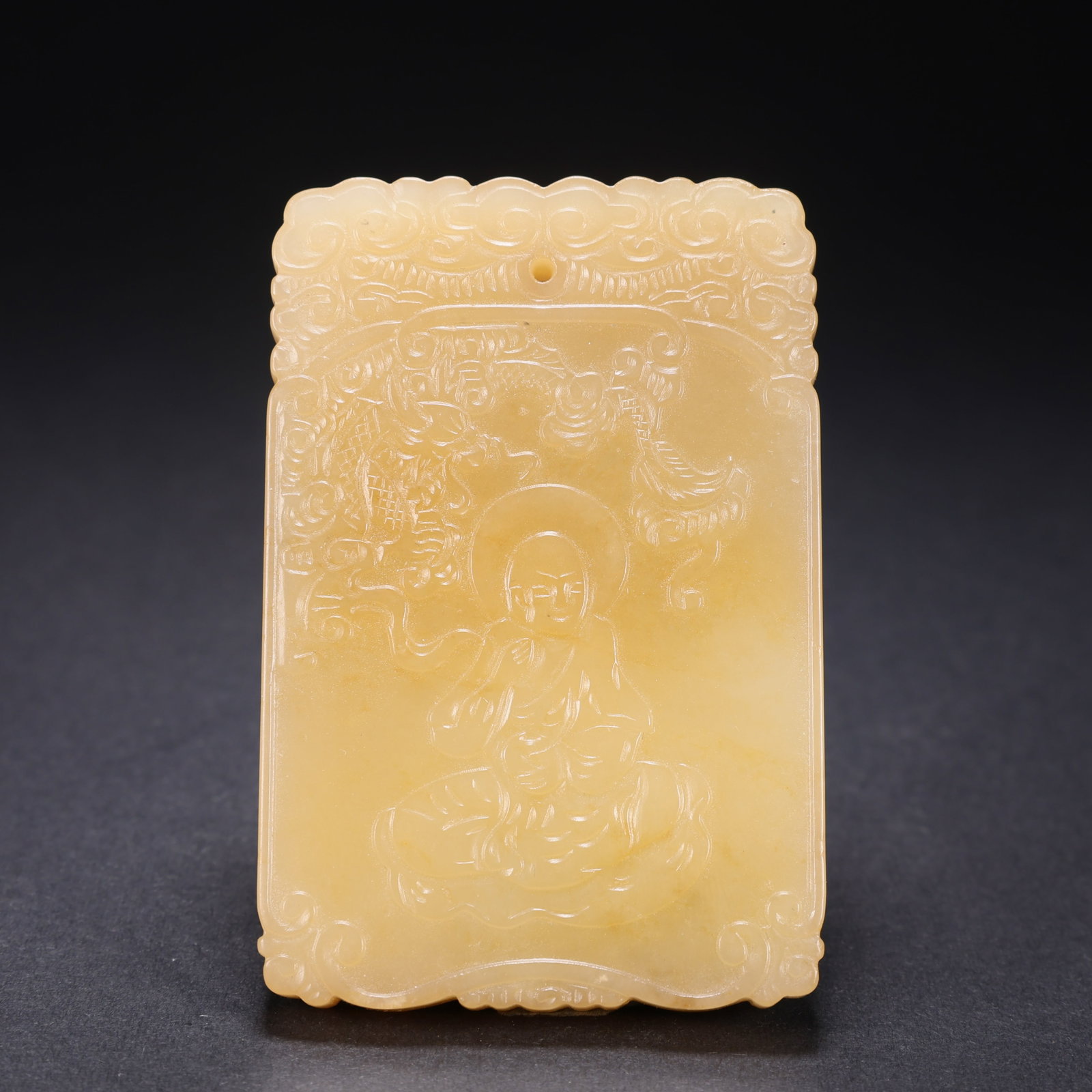 A HETIAN JADE "SUBDUING DRAGON" ARHAT PLAQUE: Hetian Jade "Subduing Dragon" Arhat Plaque