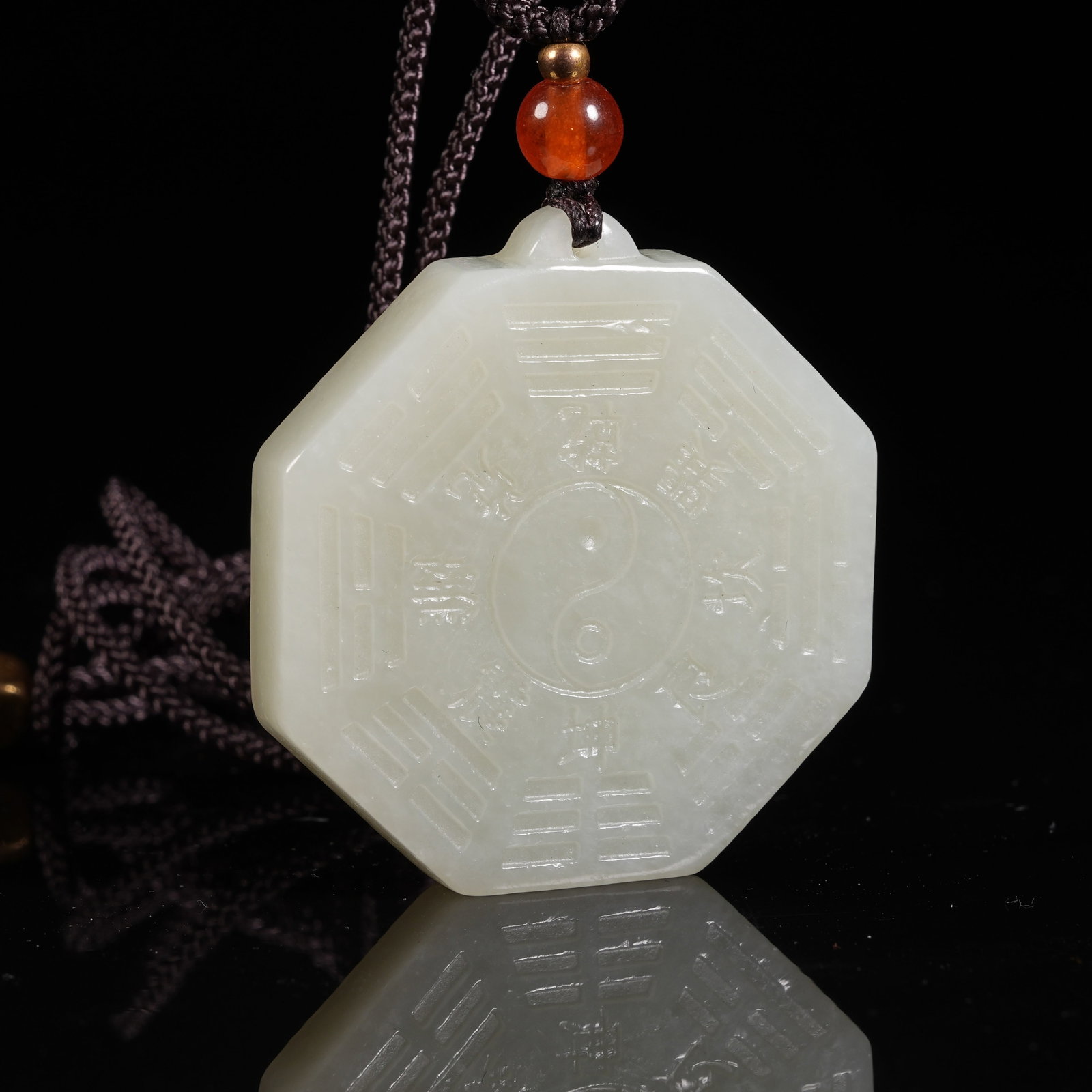 A HETIAN JADE PENDANT WITH BAGUA PATTERN: Hetian Jade Pendant with Bagua Pattern