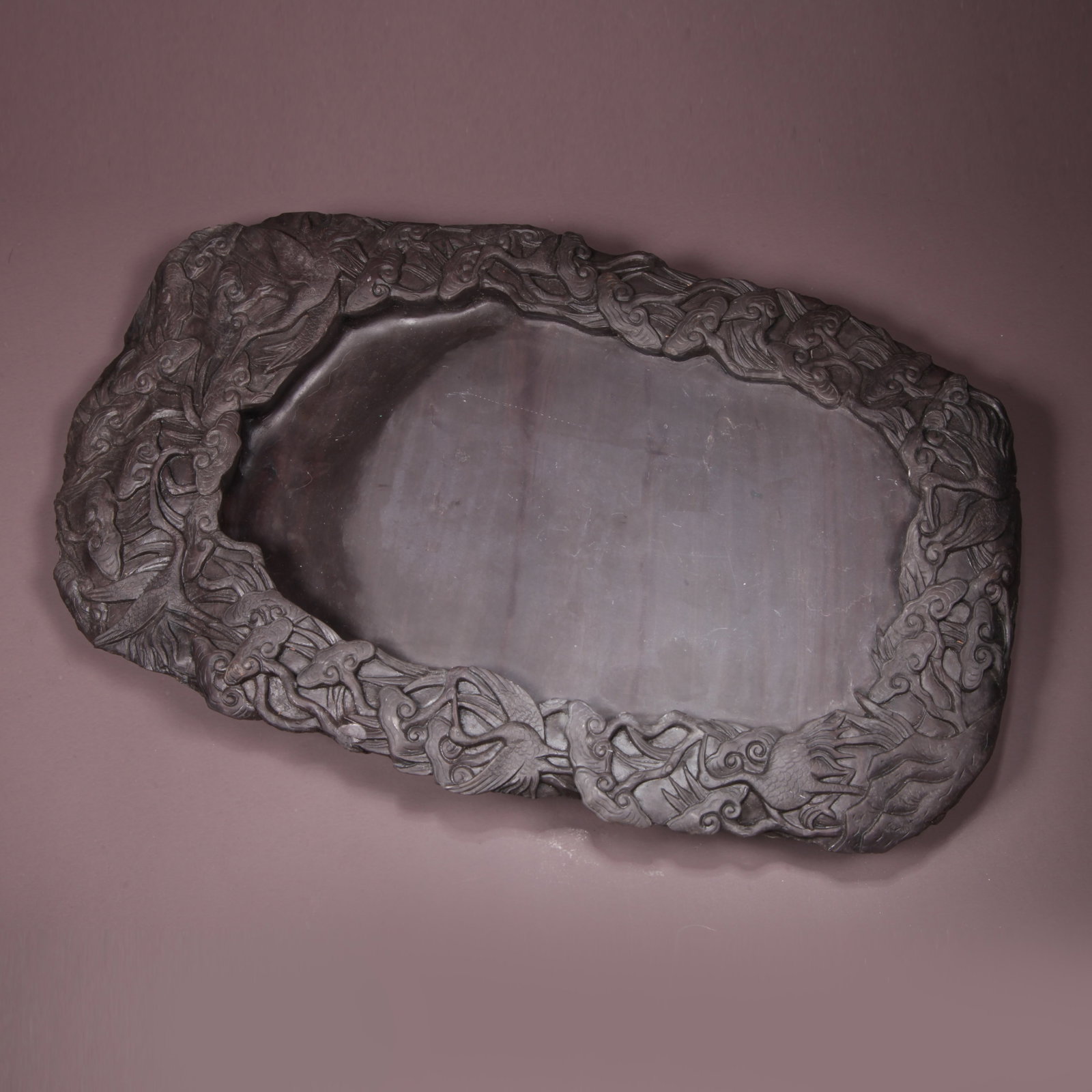 A DUANSHI INKSTONE WITH LINGZHI AND IMMORTAL CRANE PATTERN: Duanshi Inkstone with Lingzhi and Immortal Crane Pattern