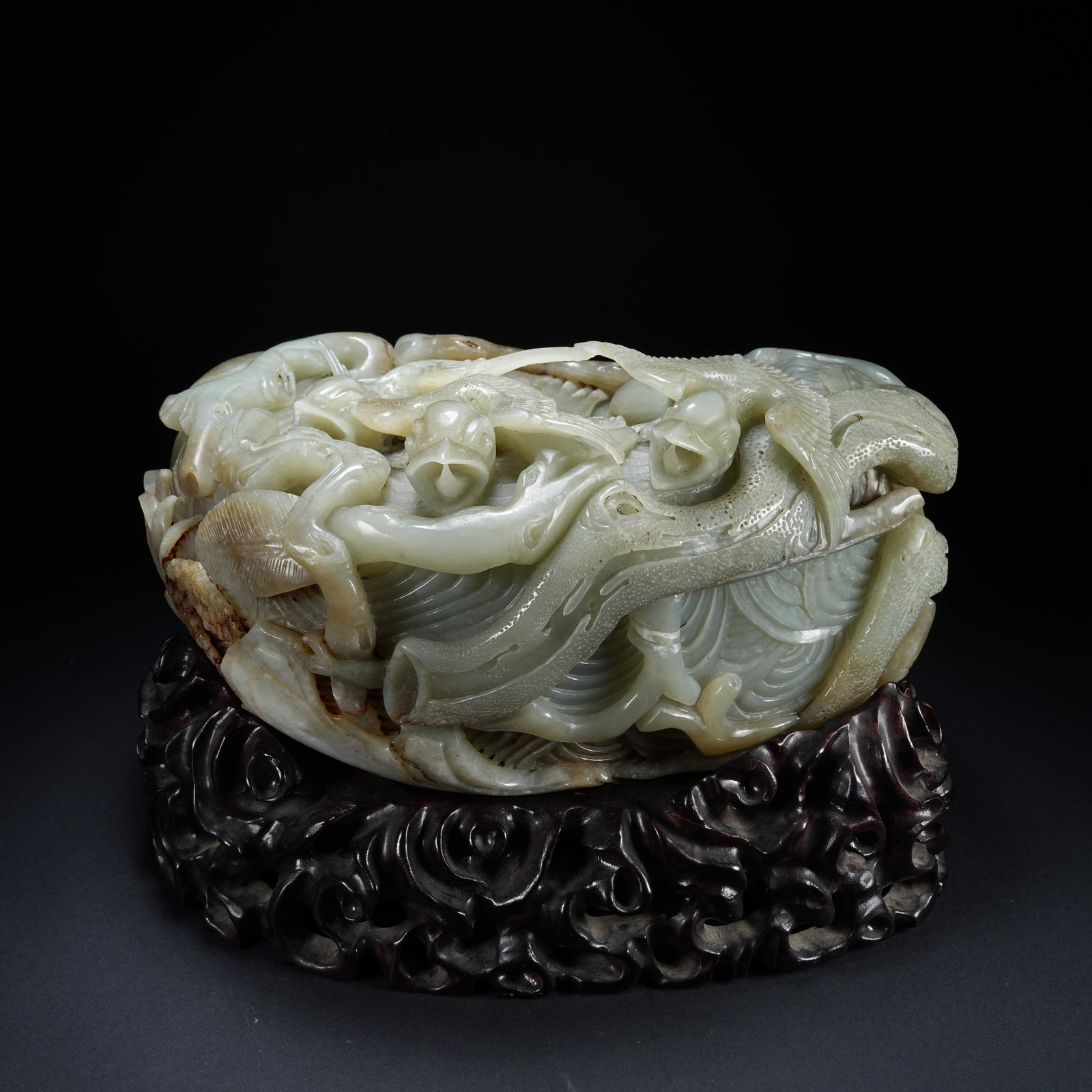 A HETIAN JADE MOUNTAIN ORNAMENT WITH BIRD NEST PATTERN: Hetian Jade Mountain Ornament with Bird Nest Pattern