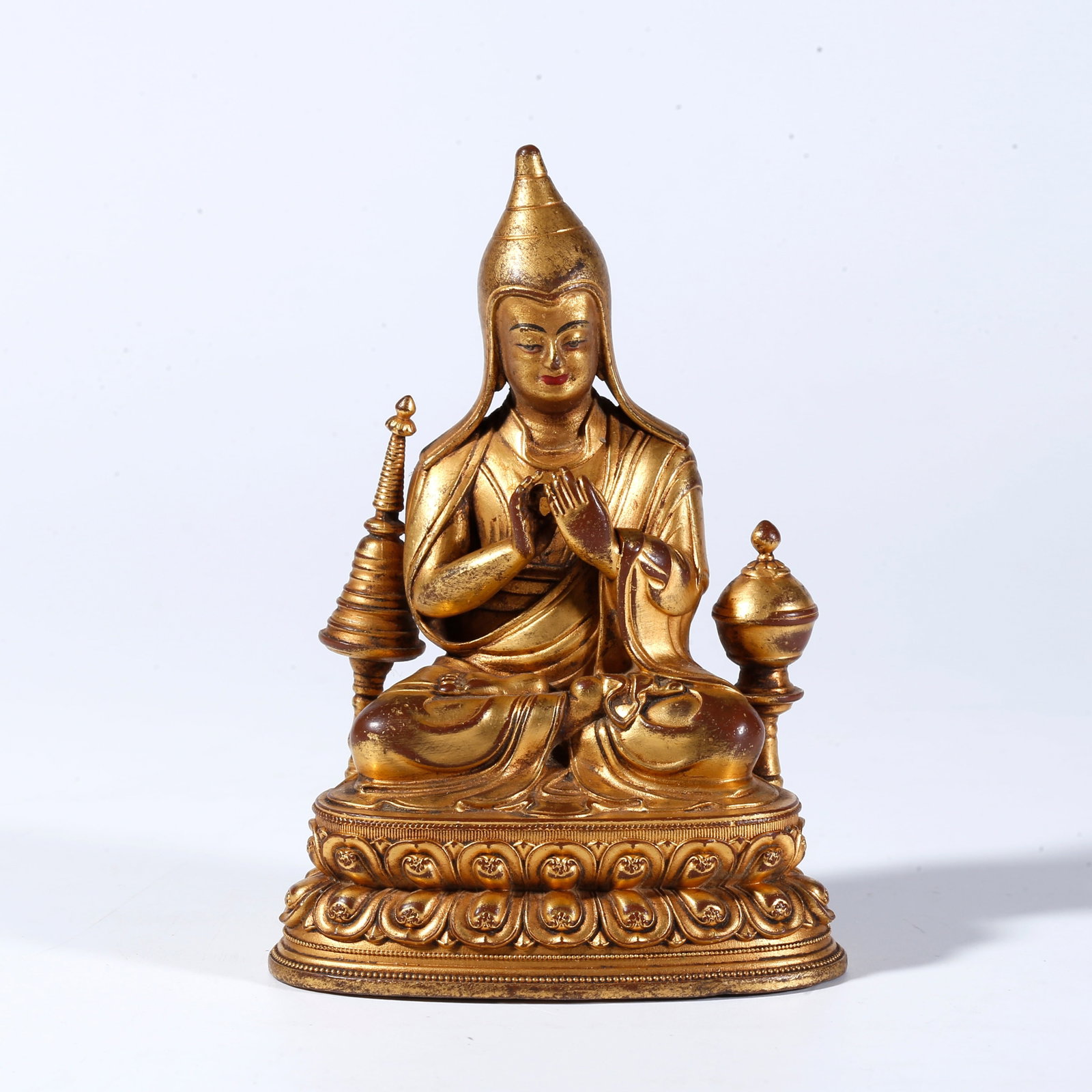 A GILT BRONZE STATUE OF A LAMA: Gilt Bronze Statue of a Lama