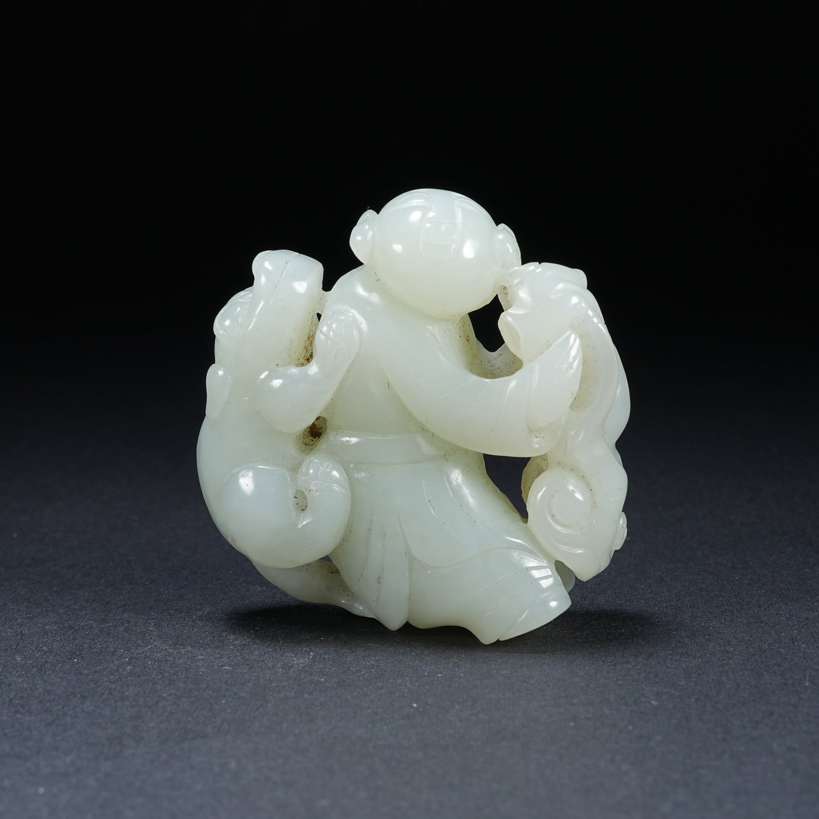 A HETIAN JADE HAND PIECE OF BOY PLAYING WITH DOG (1 of 6)