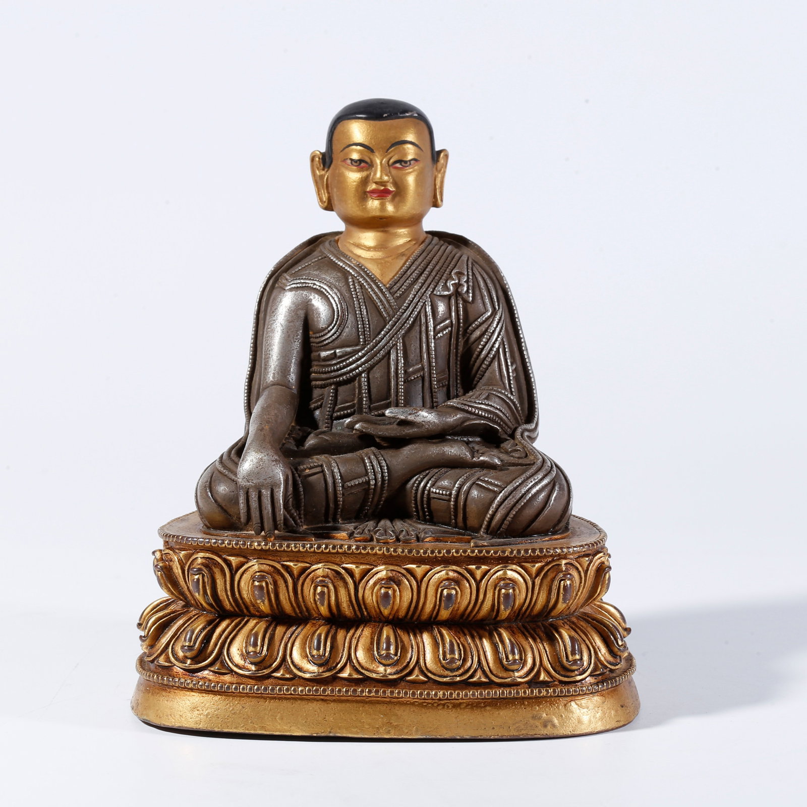 A PARTIAL GILT BRONZE STATUE OF A LAMA (1 of 9)