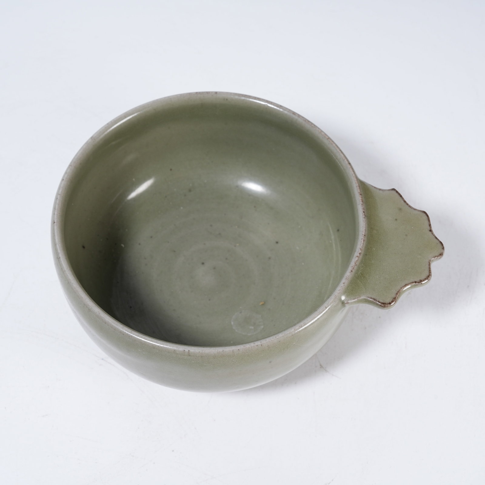 A CELADON HANDLED CUP - 7