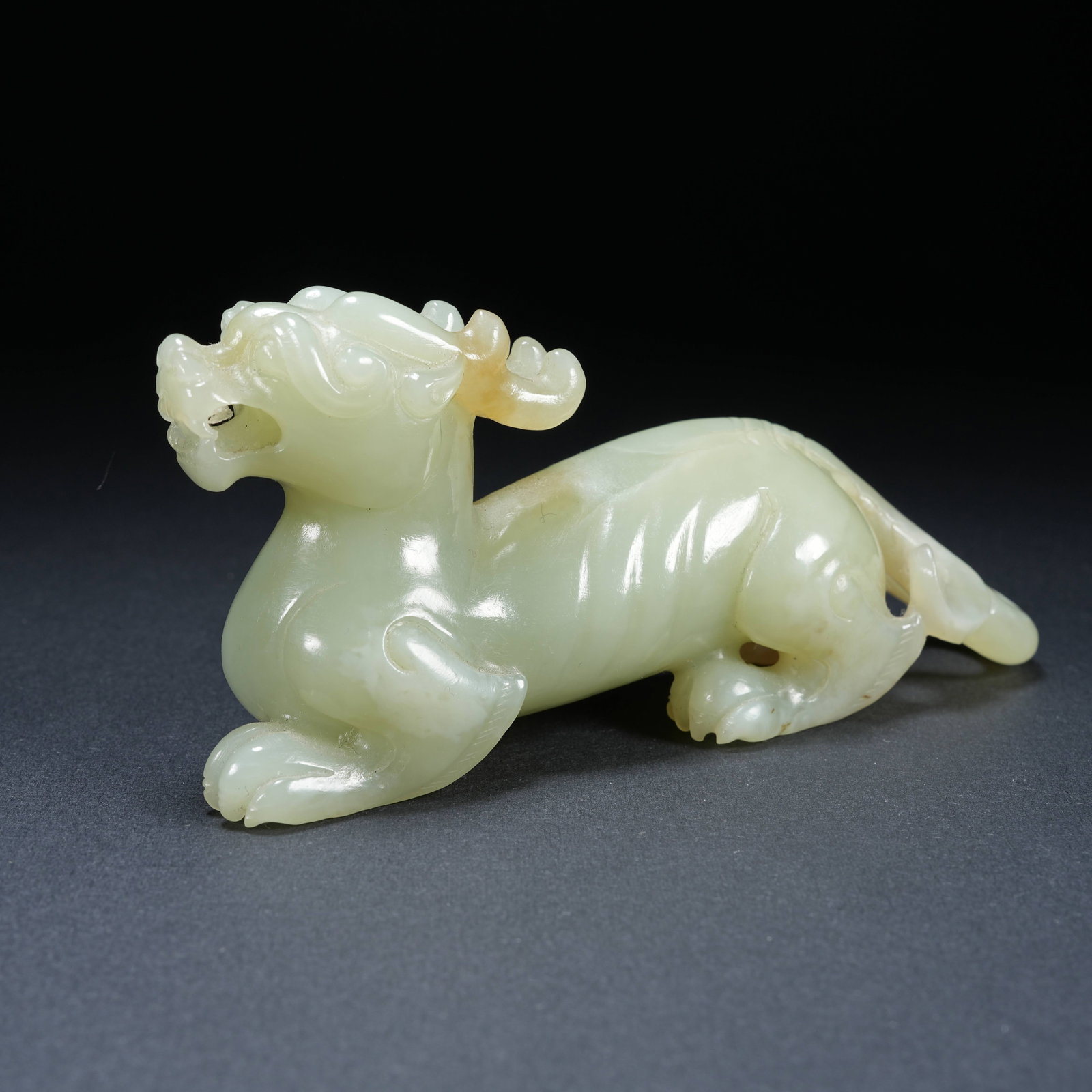 A HETIAN JADE AUSPICIOUS BEAST ORNAMENT: Hetian Jade Auspicious Beast Ornament
