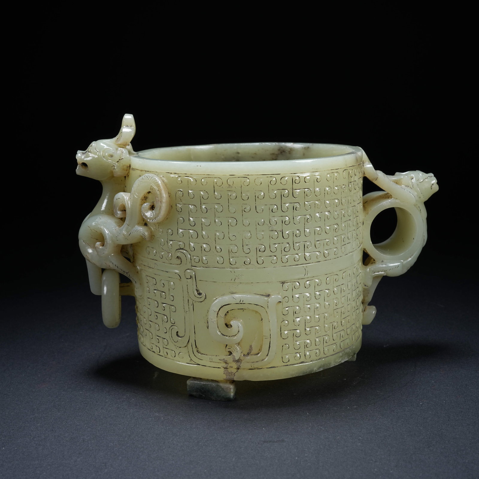 A HETIAN JADE CHILONG CUP WITH MOVEABLE RINGS AND STUD PATTERN: Hetian Jade Chilong Cup with Moveable Rings and Stud Pattern