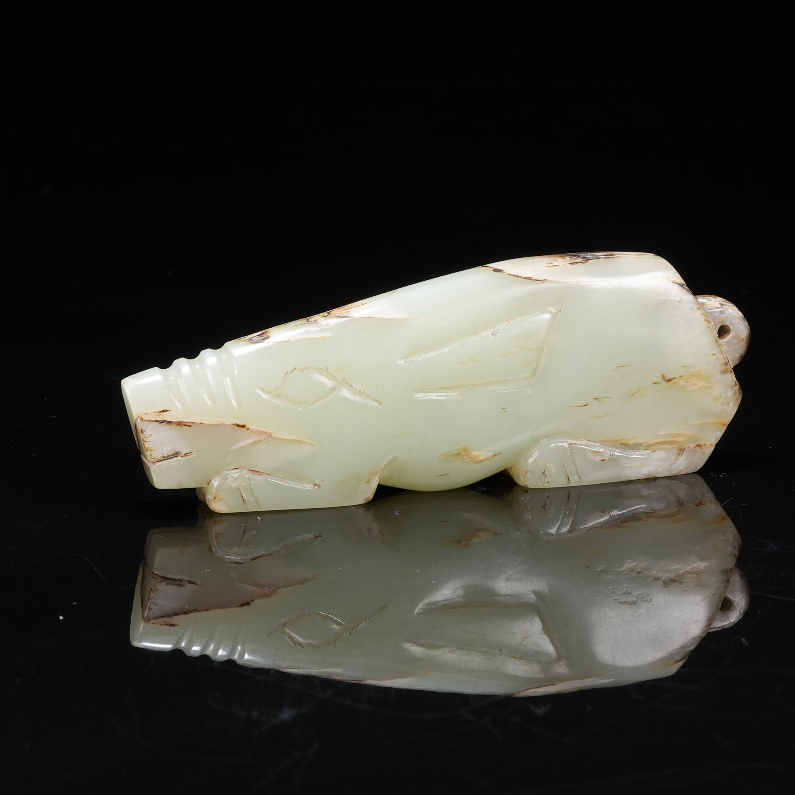 A HANDHELD ANCIENT JADE PENDANT: Handheld Ancient Jade Pendant