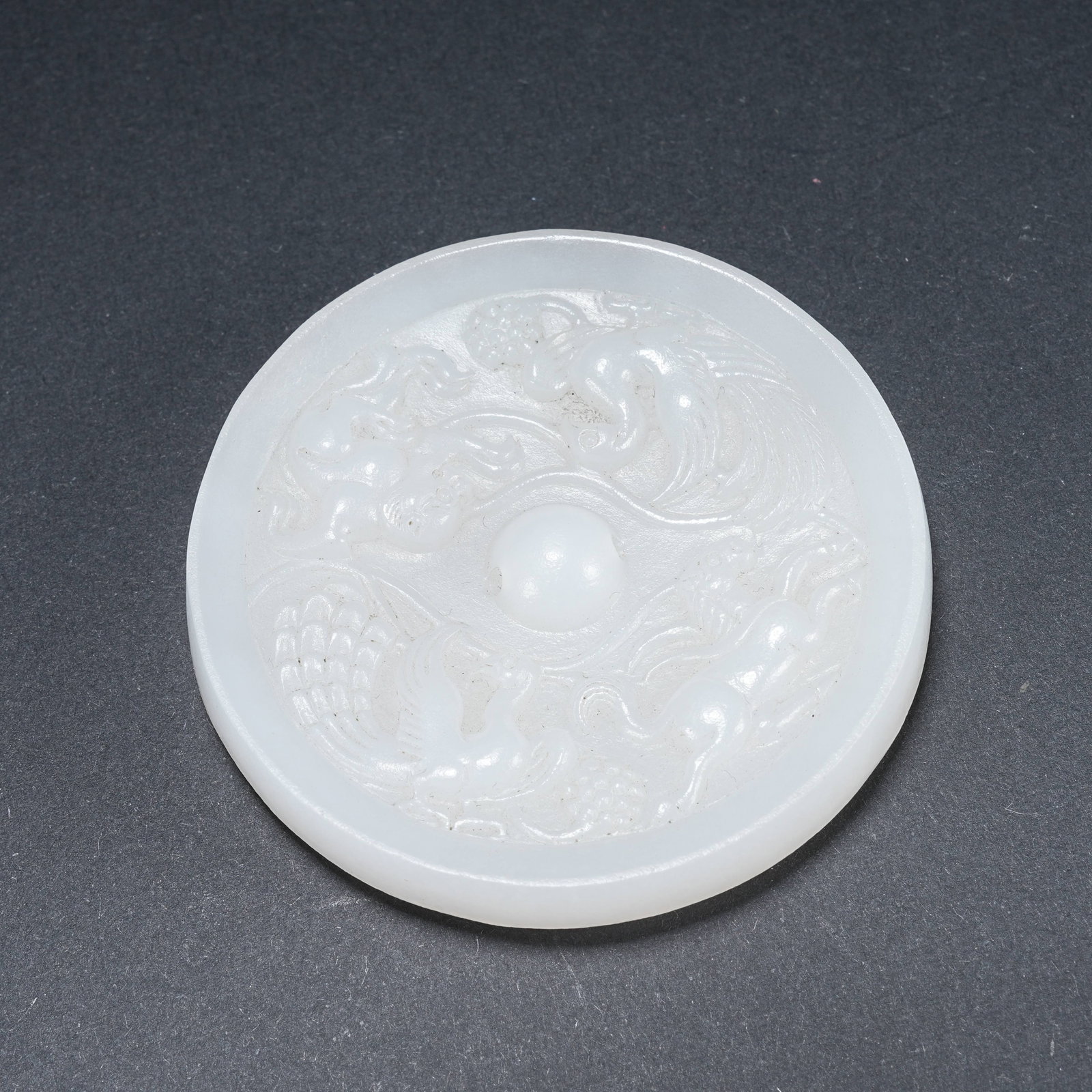 A HETIAN JADE MIRROR WITH PHOENIX AND HORSE PATTERN: Hetian Jade Mirror with Phoenix and Horse Pattern