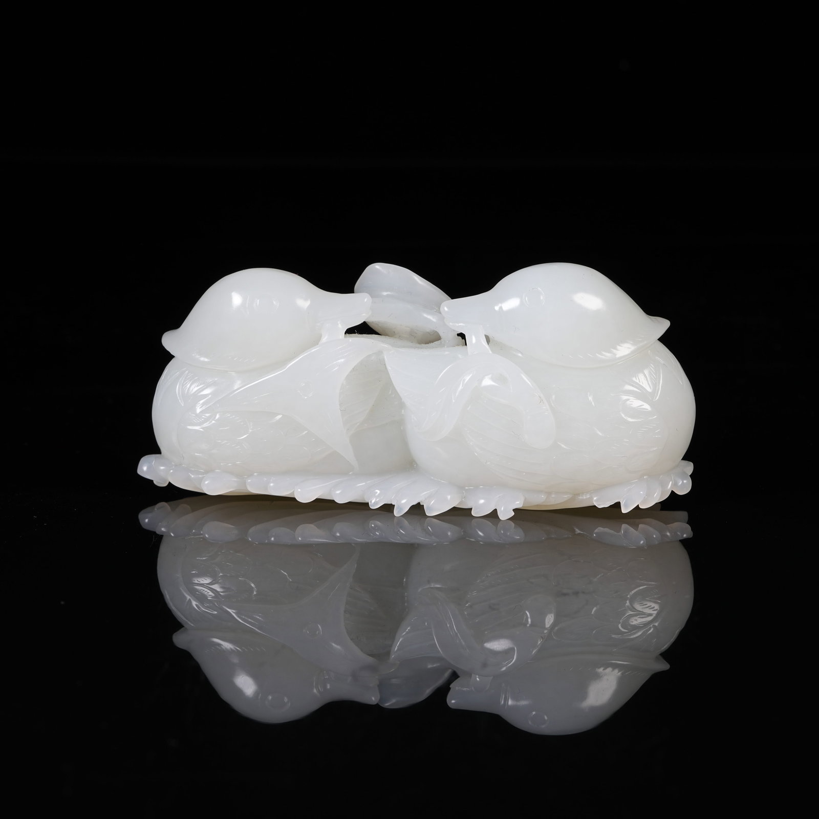A WHITE HETIAN JADE MANDARIN DUCK ORNAMENT: White Hetian Jade Mandarin Duck Ornament