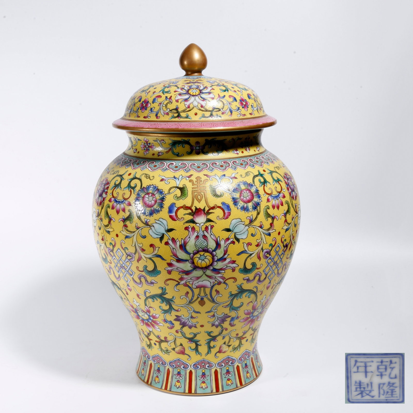 A YELLOW-GROUND CARVED FAMILLE ROSE INTERLOCKING FLORAL GENERAL JAR: Yellow-ground Carved Famille Rose Interlocking Floral General Jar