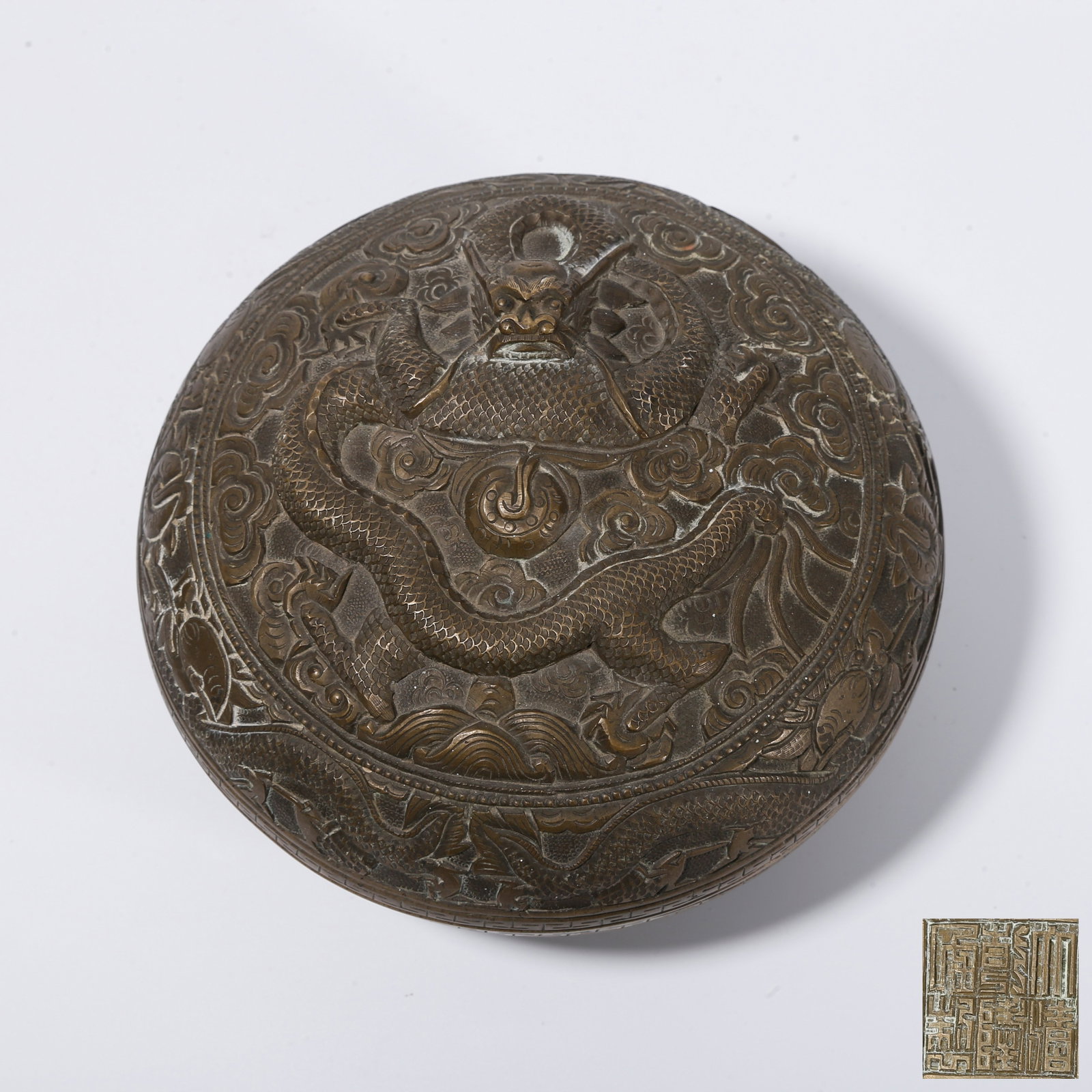 A BRONZE COVERED BOX WITH CLOUD AND DRAGON PATTERN: Bronze Covered Box with Cloud and Dragon Pattern