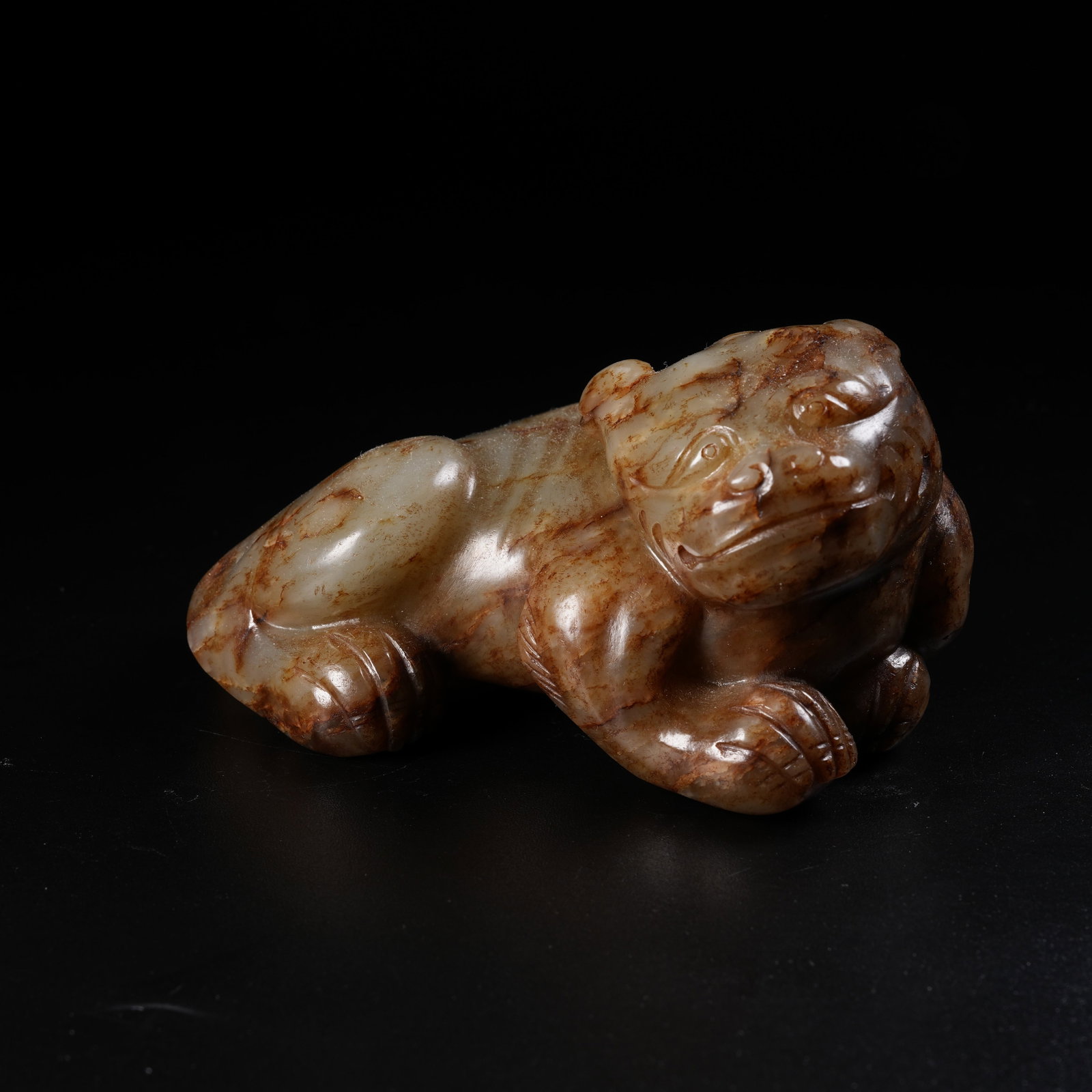 A ANCIENT JADE RECLINING BEAST ORNAMENT (1 of 8)