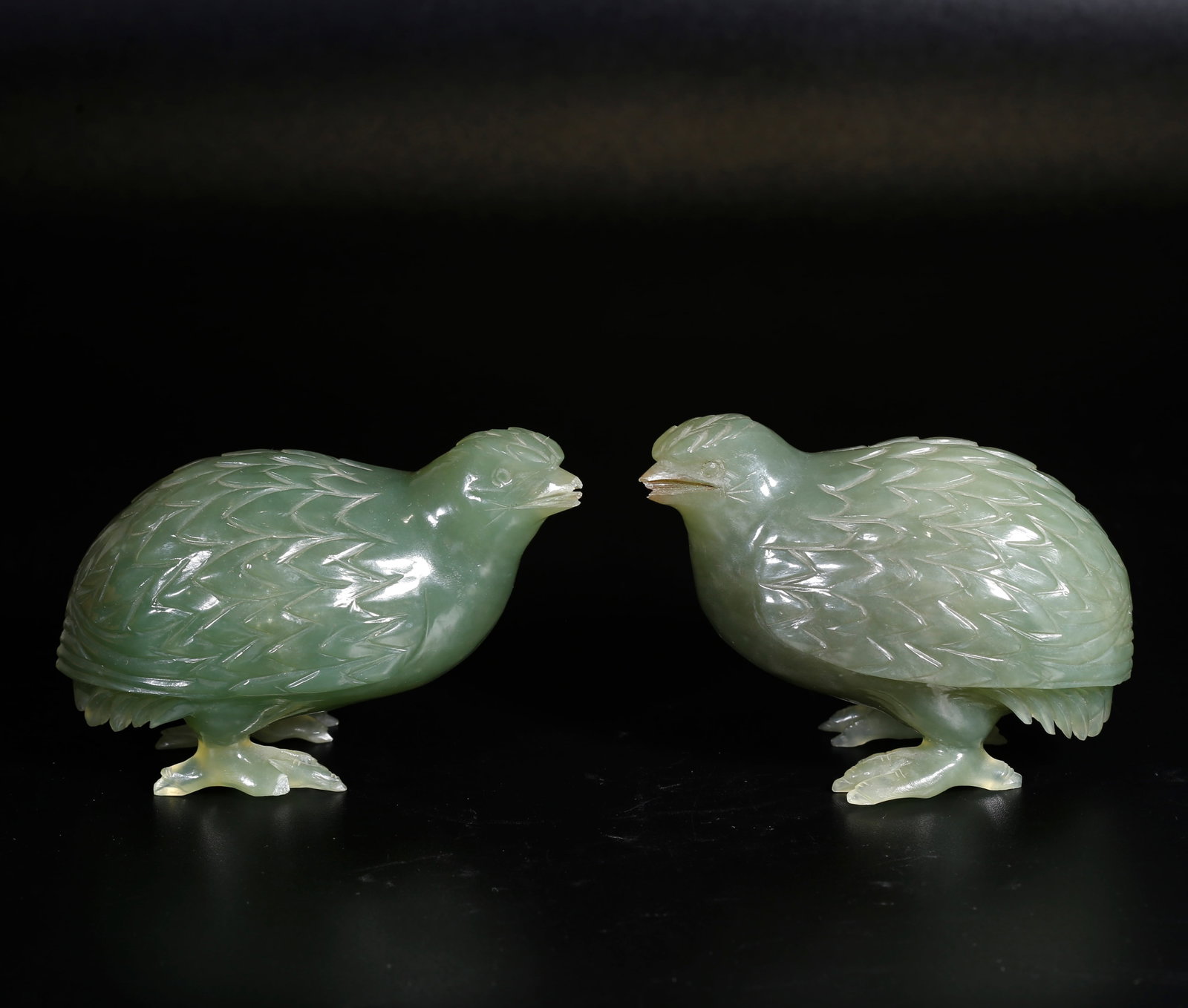 A PAIR OF HETIAN GREEN JADE QUAIL ORNAMENTS: Pair of Hetian Green Jade Quail Ornaments