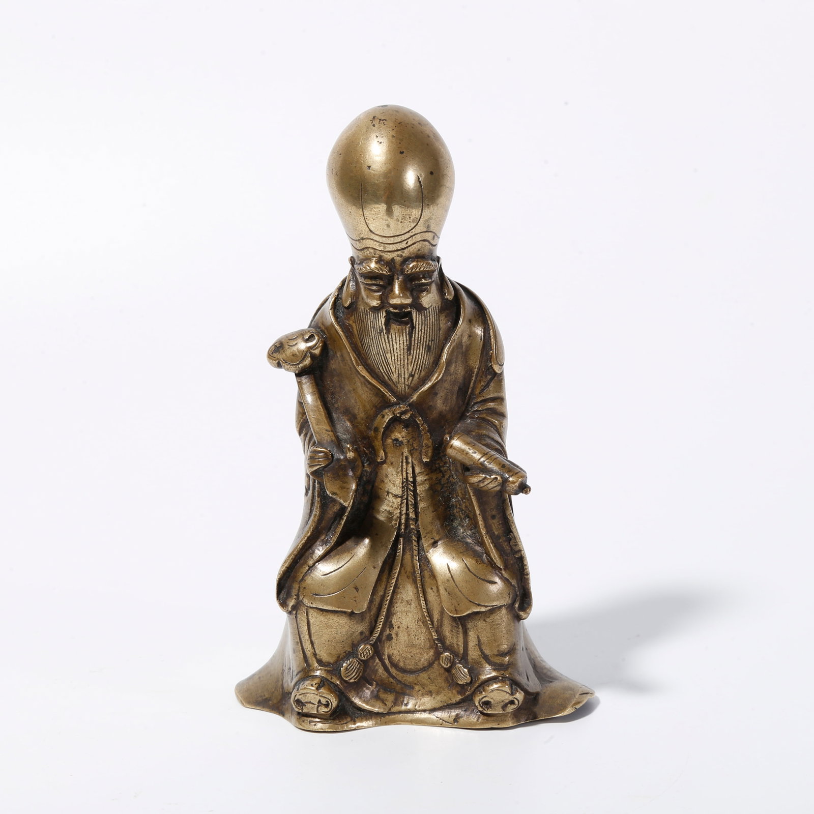A BRONZE GOD OF LONGEVITY ORNAMENT: Bronze God of Longevity Ornament