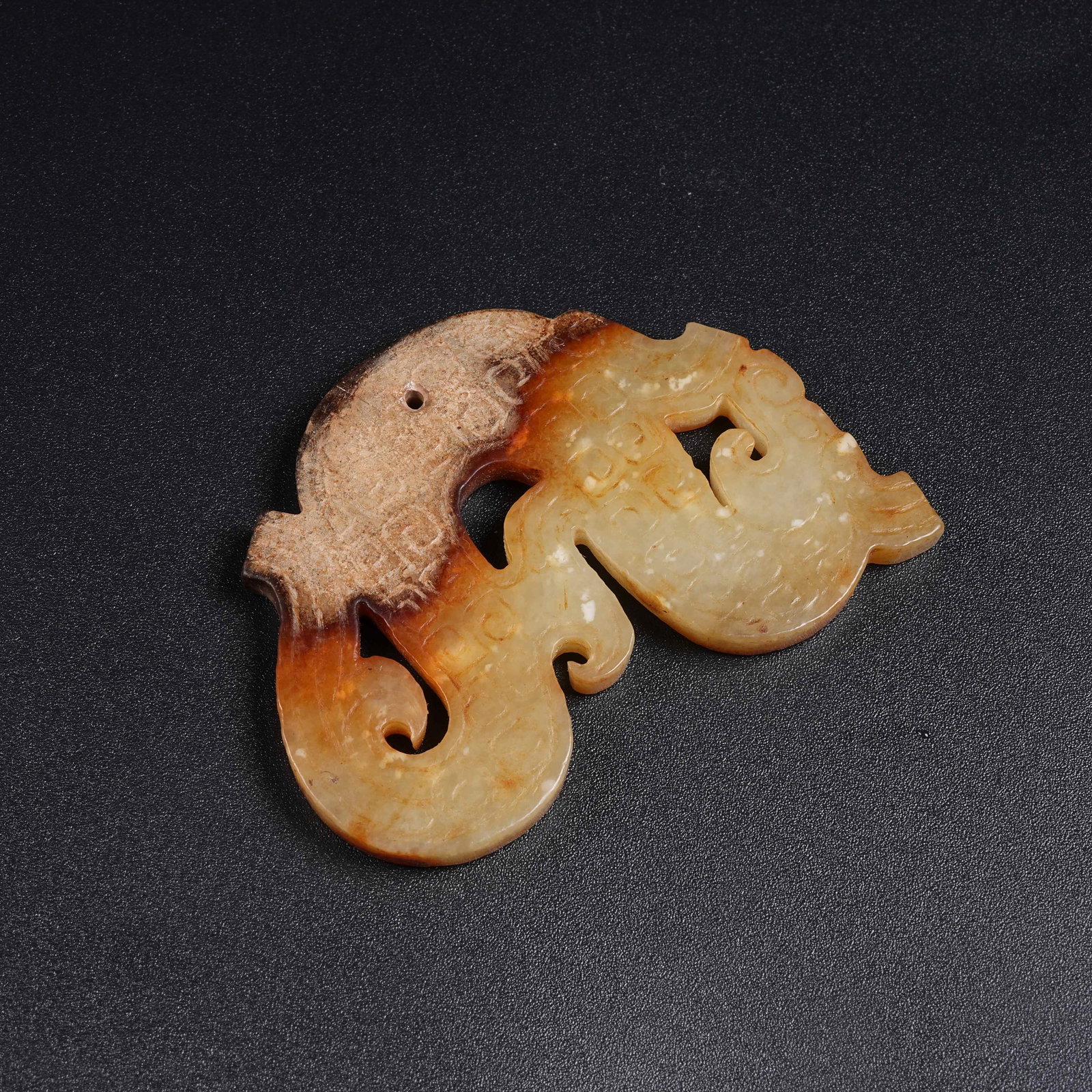 A ANCIENT JADE S-SHAPED DRAGON PENDANT: Ancient Jade S-shaped Dragon Pendant