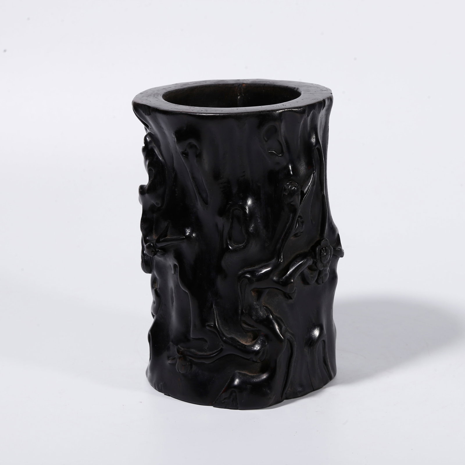 A RED SANDALWOOD BRUSH POT CARVED WITH PLUM BLOSSOM PATTERNS: Red Sandalwood Brush Pot Carved with Plum Blossom Patterns