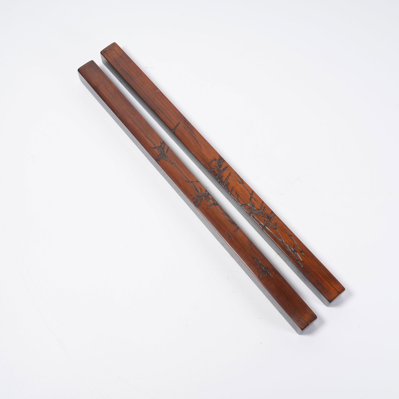 A SET OF EBONY PAPER WEIGHTS INLAID WITH BAMBOO AND FLORAL PATTERNS: Set of Ebony Paper Weights Inlaid with Bamboo and Floral Patterns