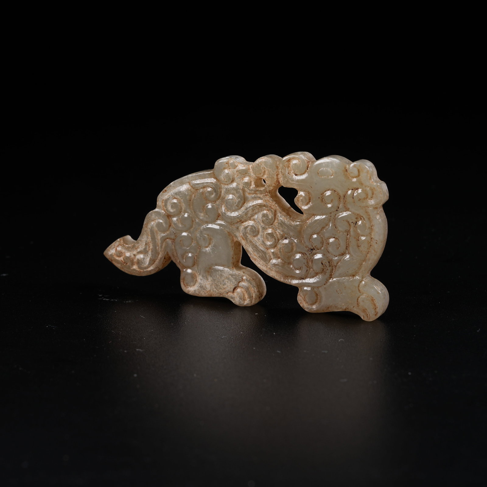 A ANCIENT JADE S-SHAPED DRAGON PENDANT: Ancient Jade S-shaped Dragon Pendant