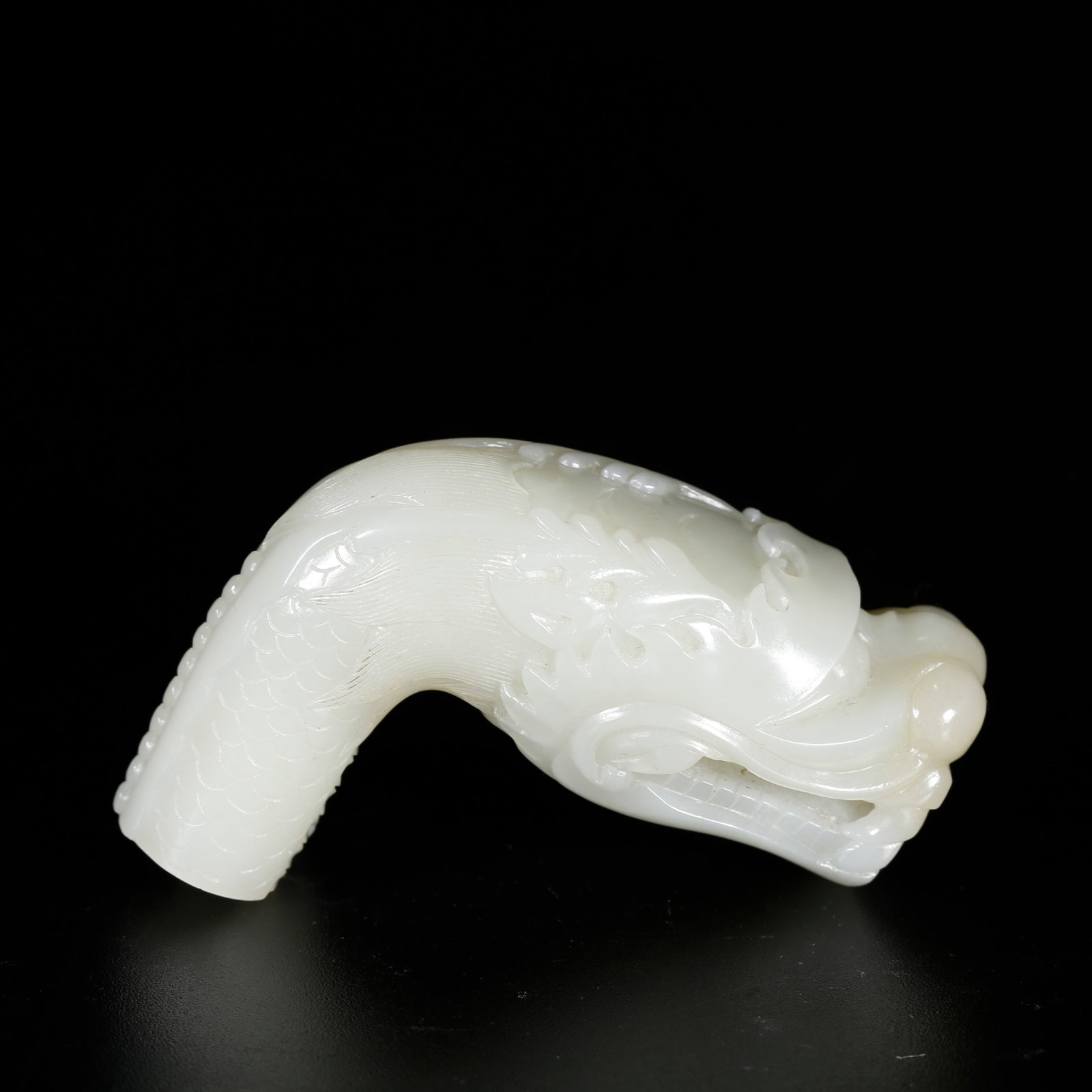A HETIAN JADE DRAGON-SHAPED CANE HEAD (1 of 10)