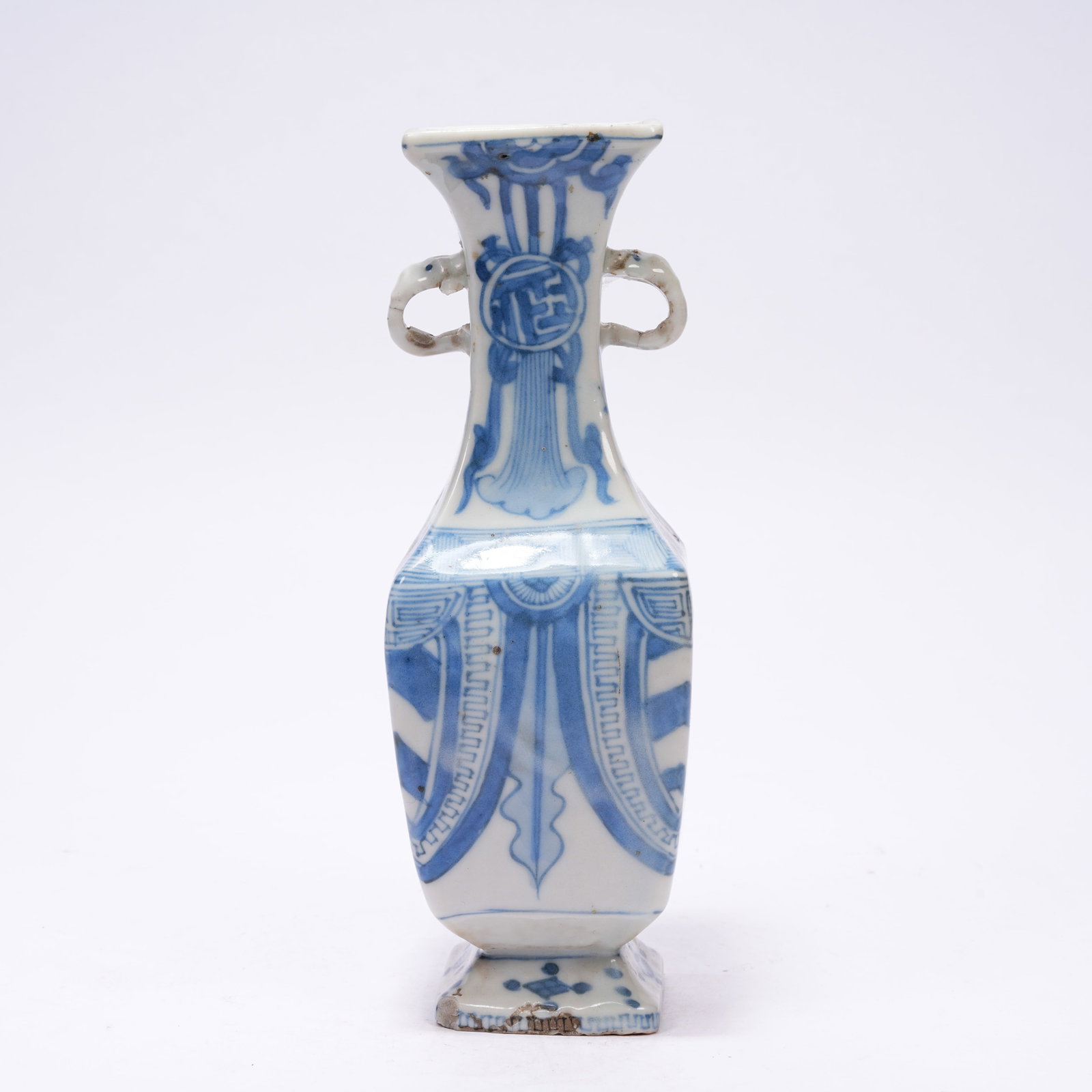A BLUE AND WHITE ELEPHANT-EAR ZUN WITH ANTIQUE MOTIFS: Blue and White Elephant-ear Zun with Antique Motifs