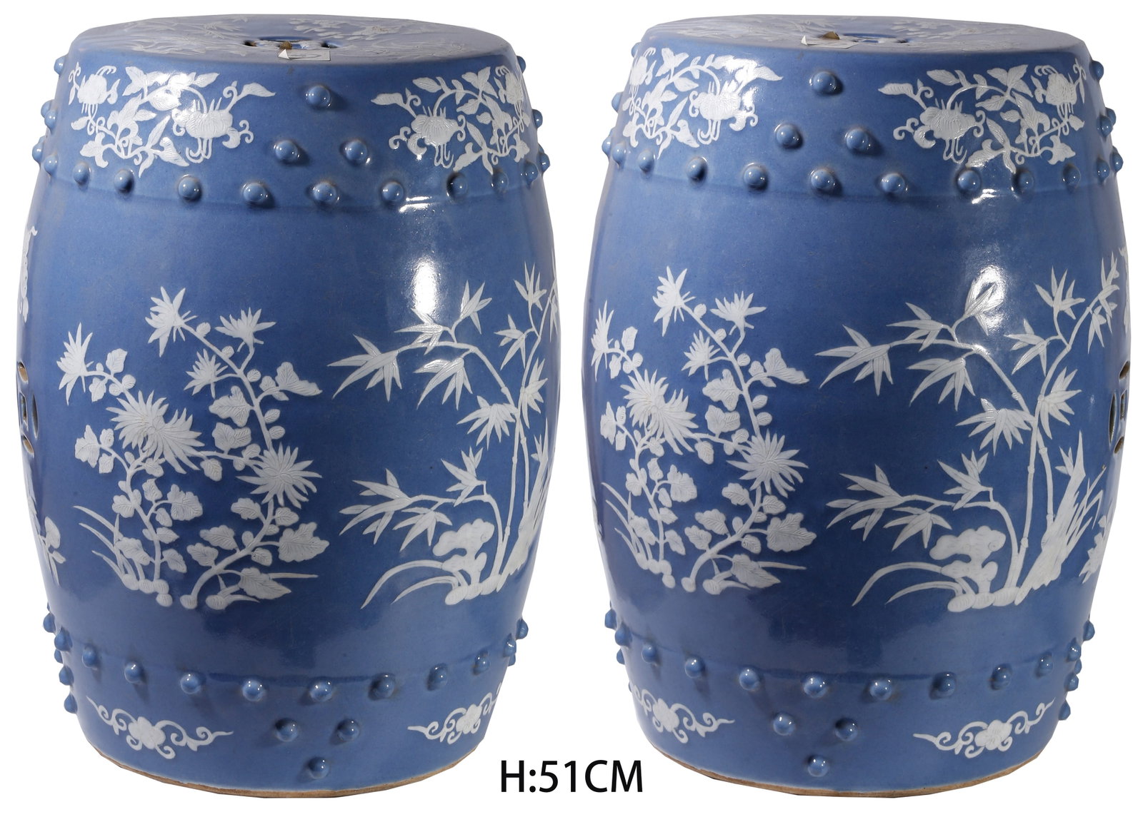 A PAIR OF BLUE GLAZE DRUM STOOLS WITH RAISED WHITE FLORAL PATTERNS (1 of 11)