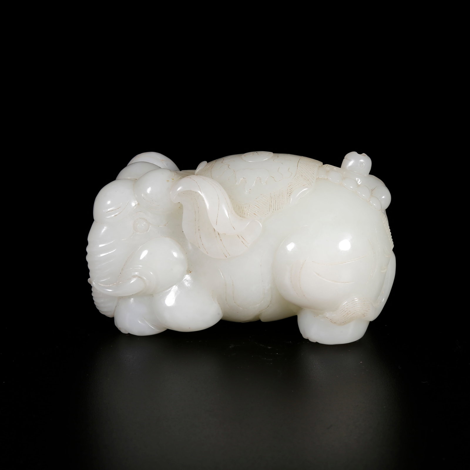 A HETIAN JADE ORNAMENT CARVED WITH ELEPHANT SYMBOLIZING PEACE (1 of 10)