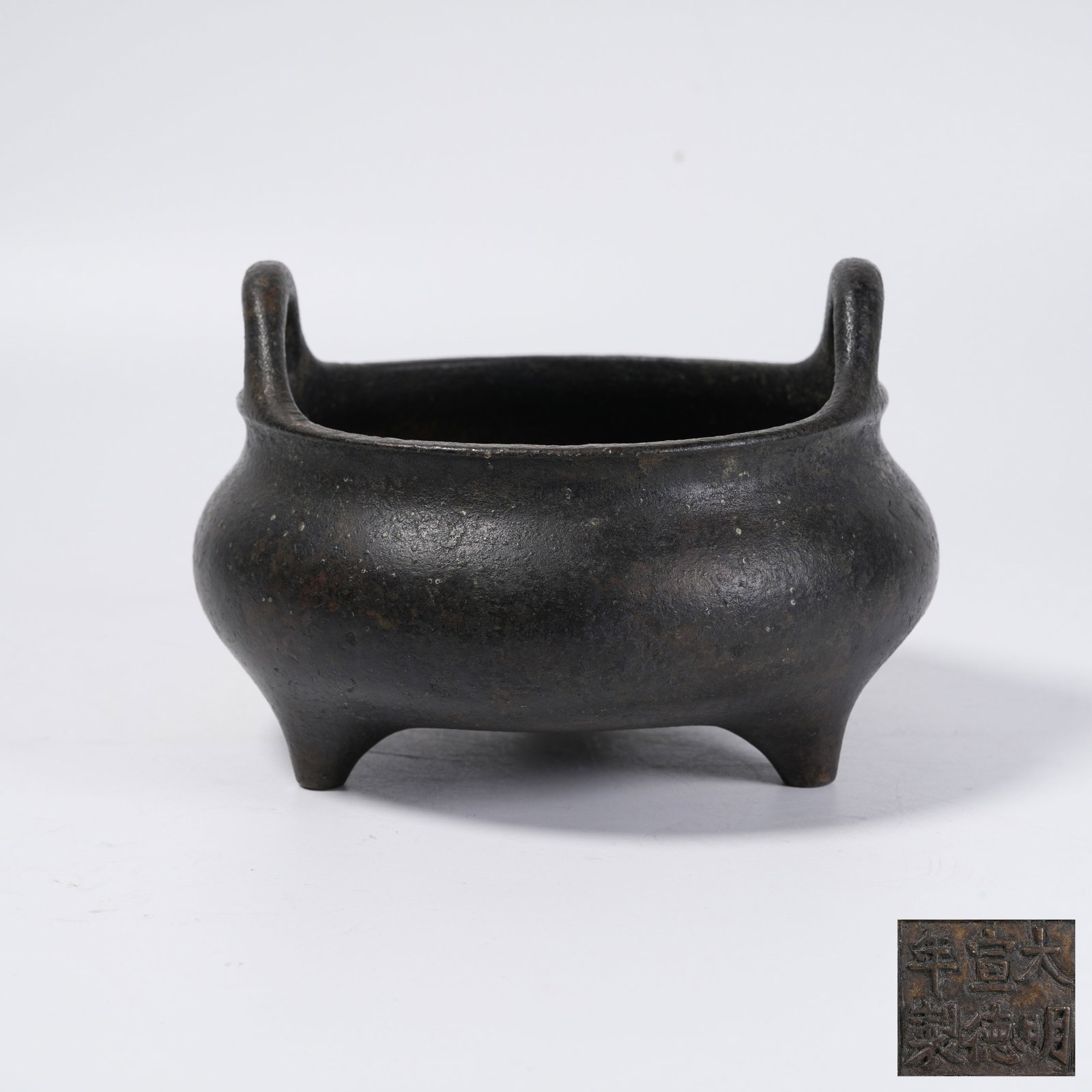 A THREE-LEGGED BRONZE CENSER WITH UPRIGHT EARS: Three-Legged Bronze Censer with Upright Ears