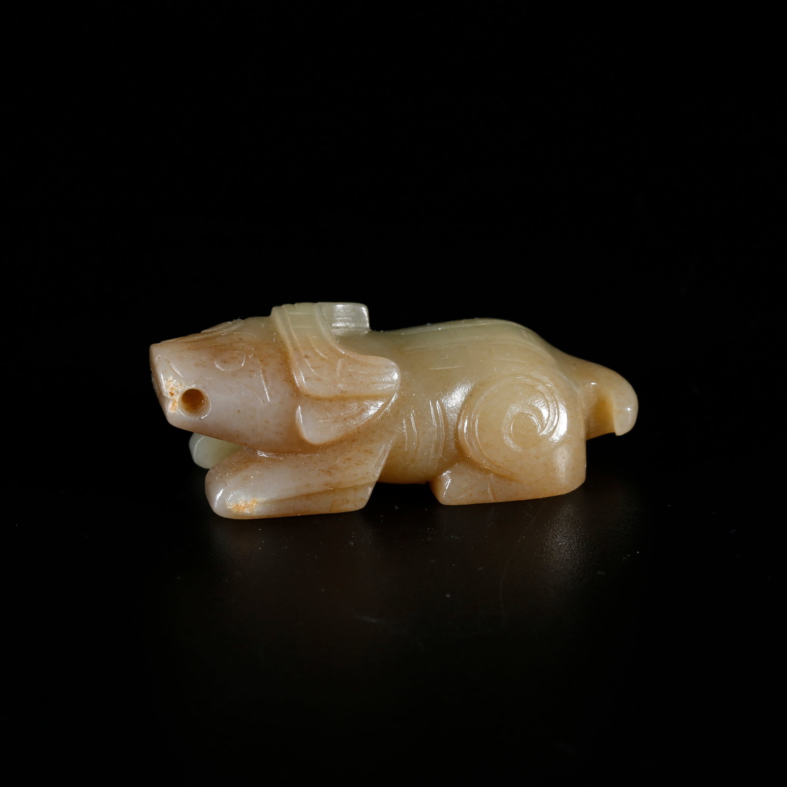 A HETIAN JADE OX-SHAPED ORNAMENT (1 of 9)