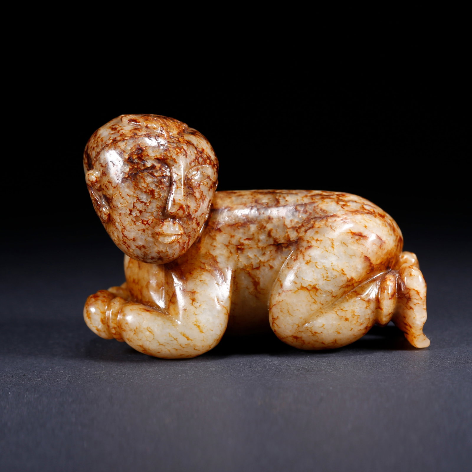 A HUMAN-SHAPED CARVED HETIAN JADE ORNAMENT: Human-shaped Carved Hetian Jade Ornament