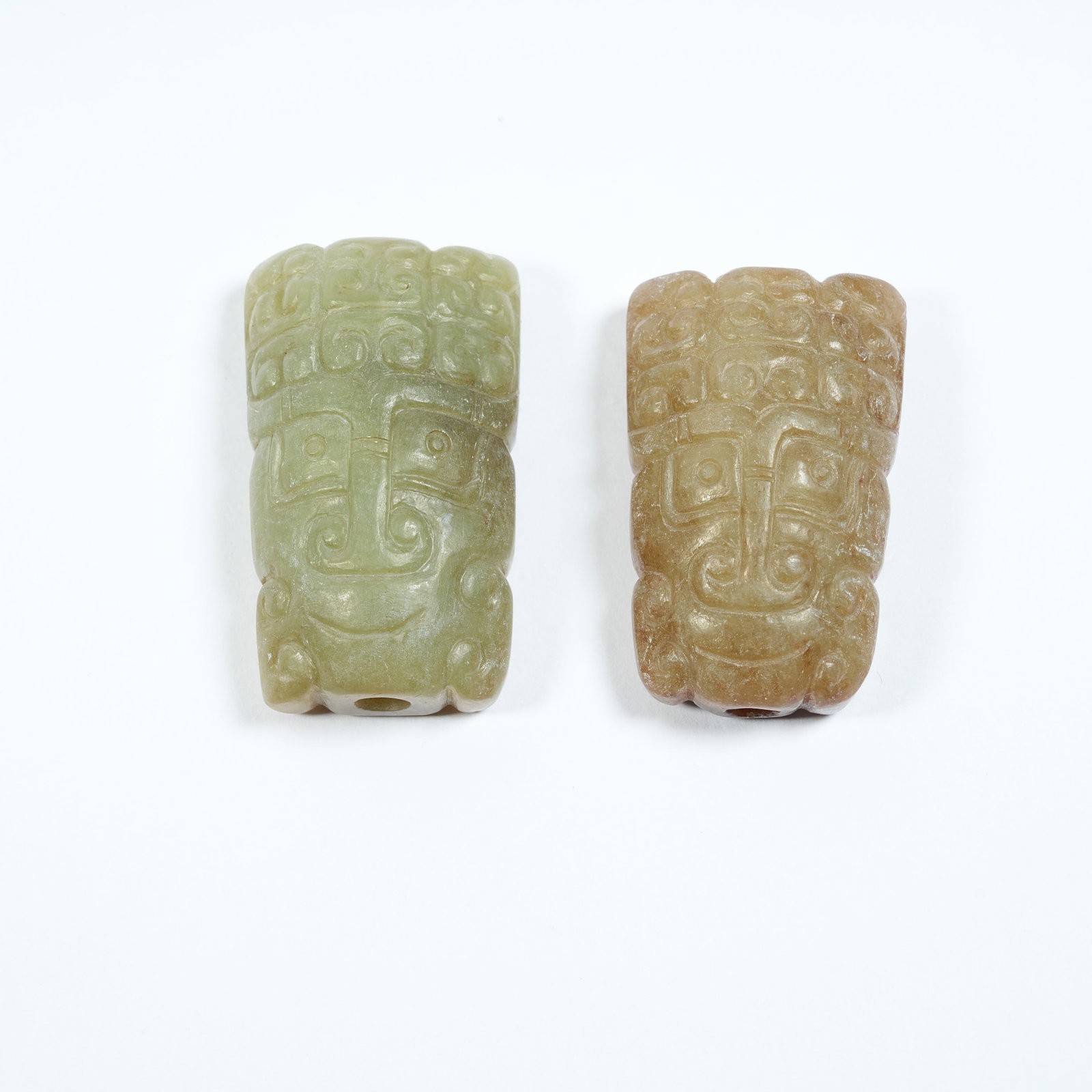 A ANCIENT JADE PENDANT WITH DEITY MASK: Ancient Jade Pendant with Deity Mask