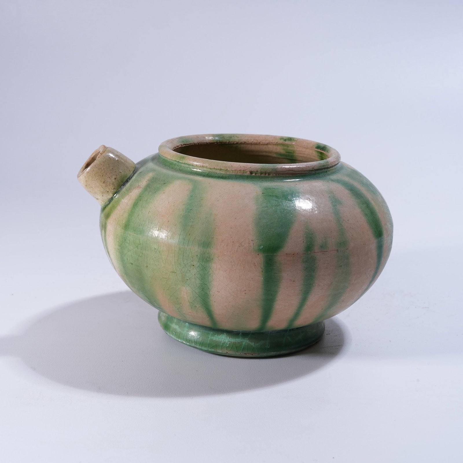 A WHITE-GLAZED EWER WITH GREEN ENAMEL DECORATION: White-Glazed Ewer with Green Enamel Decoration