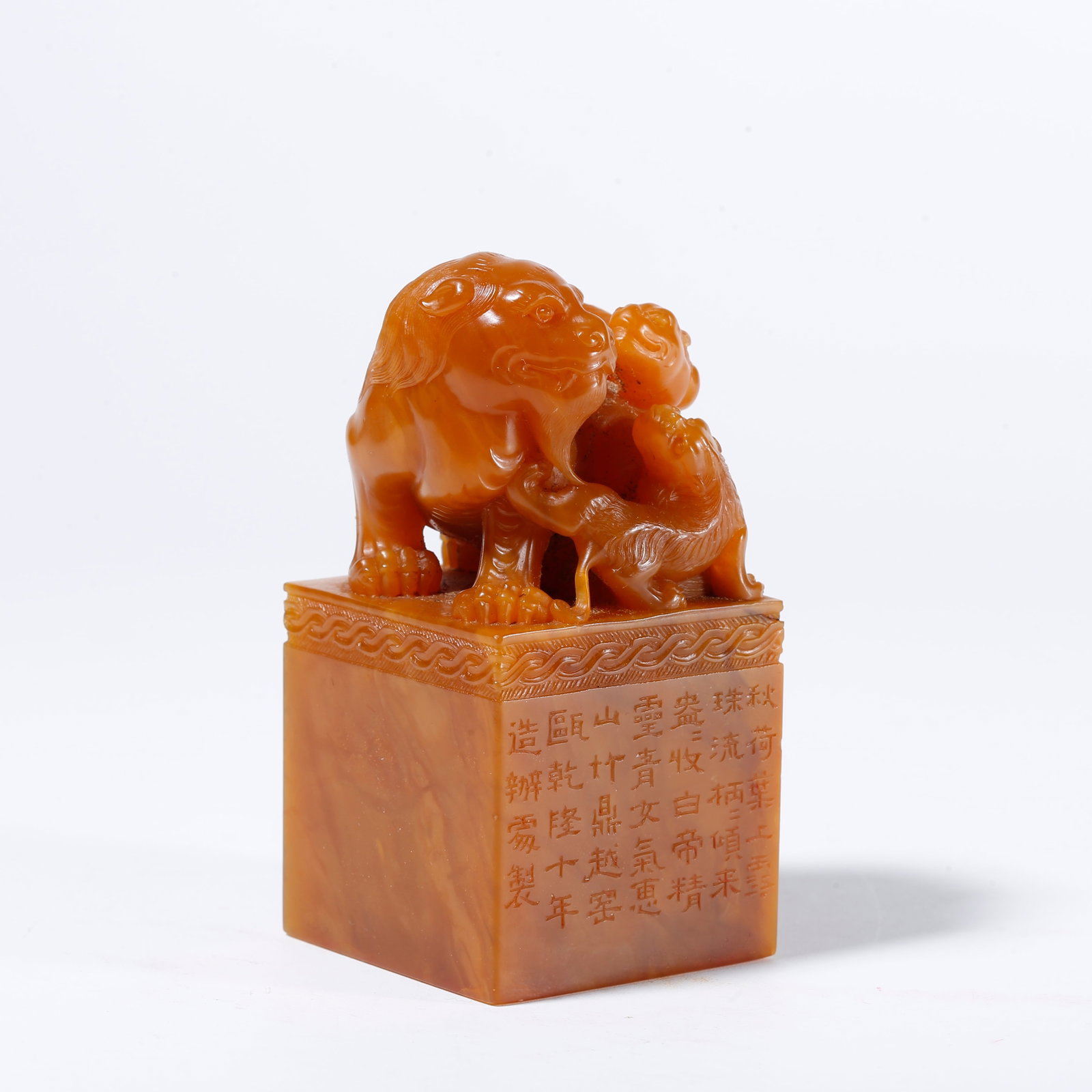 A SHOUSHAN TIANHUANG STONE SEAL WITH LION AND CUB KNOB: Shoushan Tianhuang Stone Seal with Lion and Cub Knob