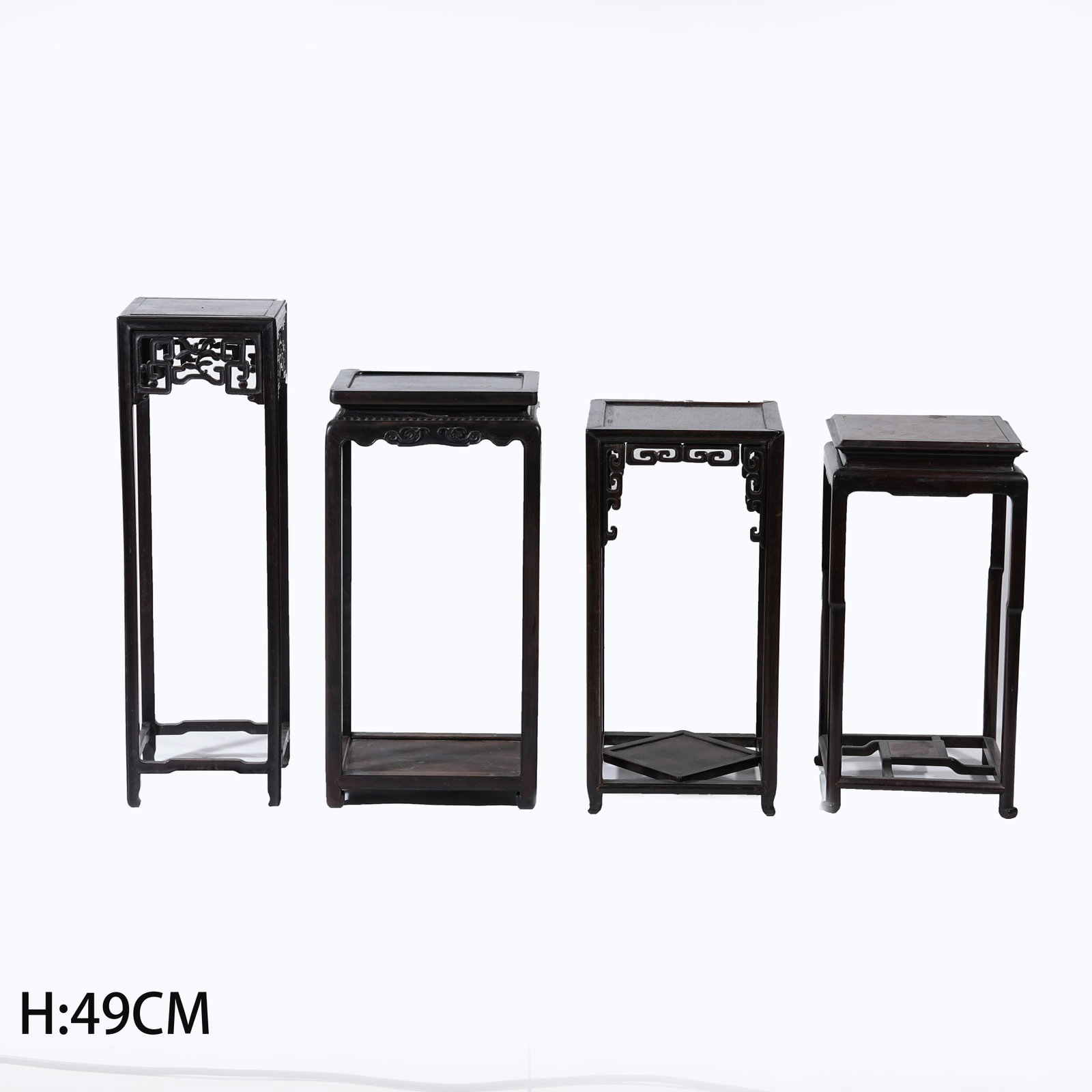 A SET OF FOUR HUANGHUALI WOOD STANDS (1 of 15)