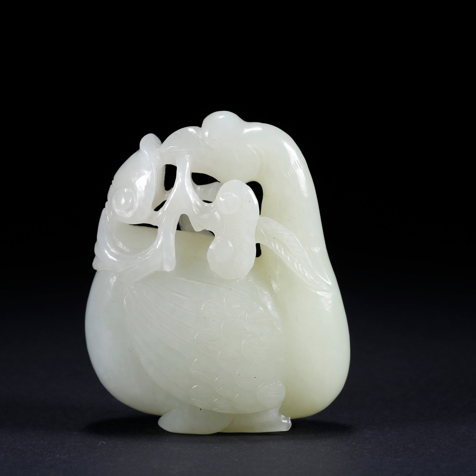 A BEAST-SHAPED CARVED HETIAN JADE ORNAMENT (1 of 9)