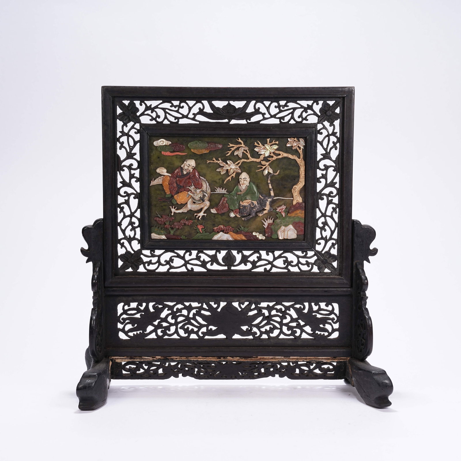 A RED SANDALWOOD TREASURE-INLAID TABLE SCREEN WITH ARHATS SUBDUING DRAGONS AND TIGERS: Red Sandalwood Treasure-inlaid Table Screen with Arhats Subduing Dragons and Tigers