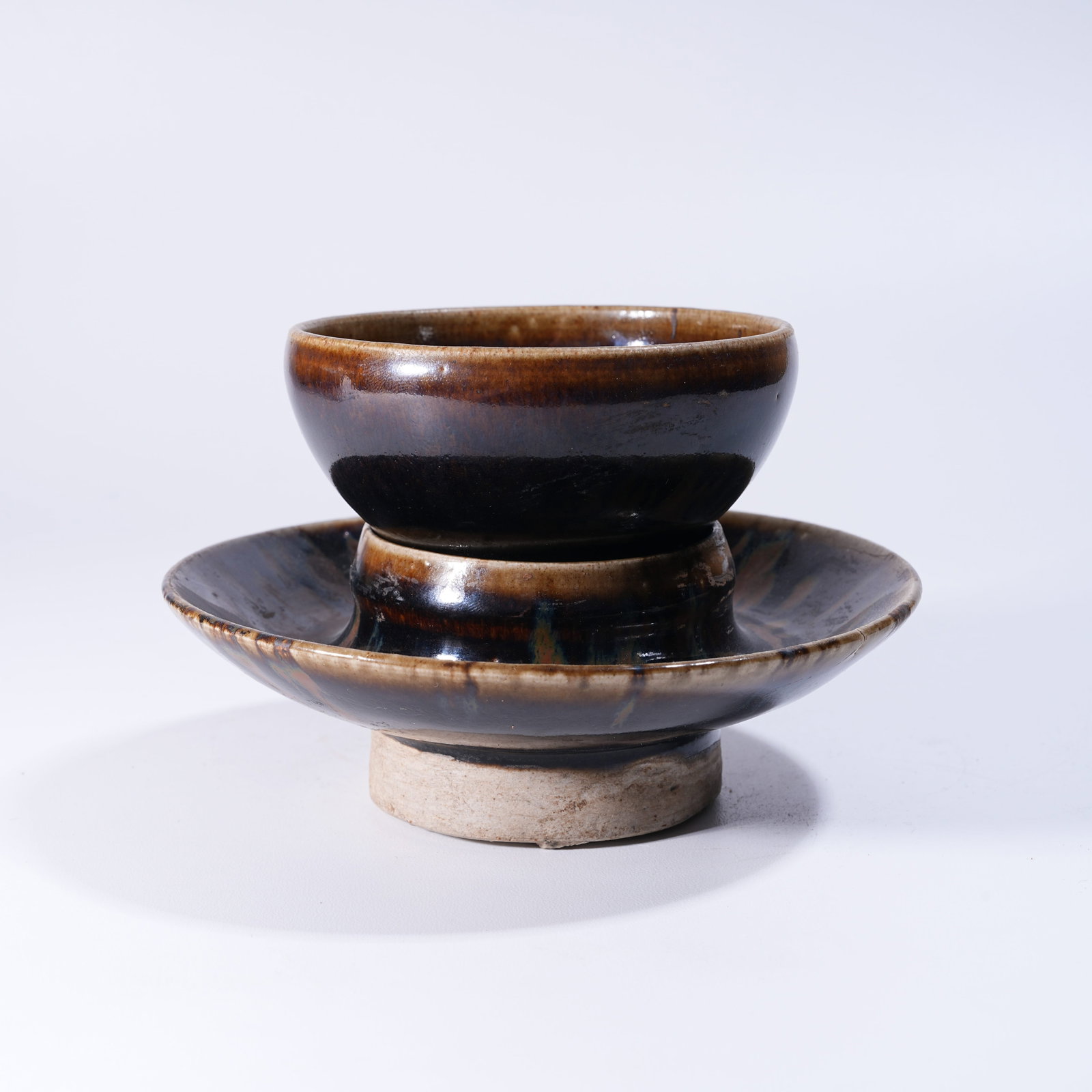 A SET OF JIAN KILN TEA BOWL STANDS (1 of 8)