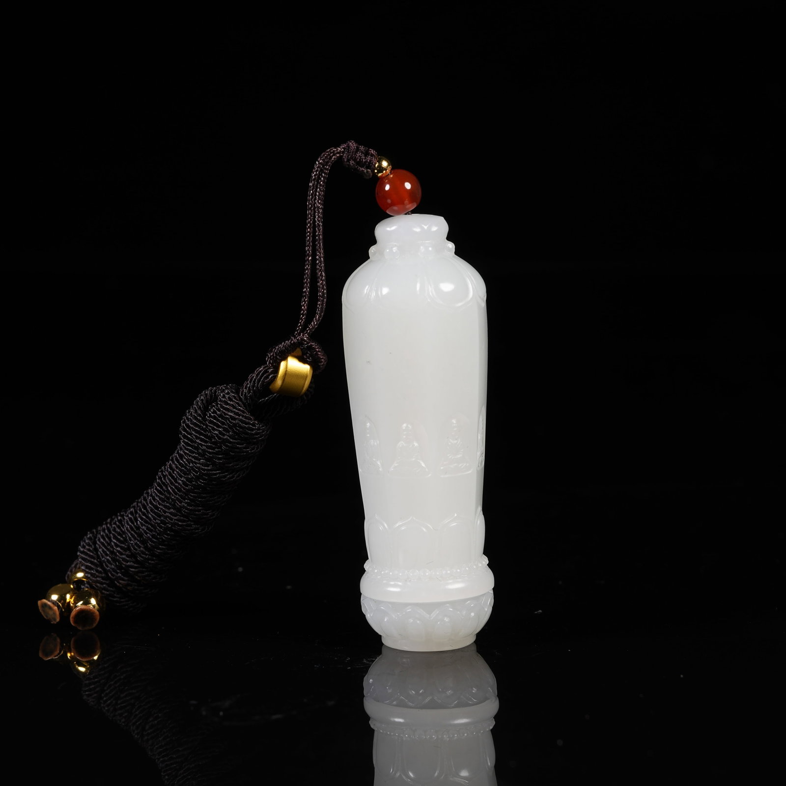 A WHITE HETIAN JADE PENDANT WITH BUDDHA IN HEART MOTIF: White Hetian Jade Pendant with Buddha in Heart Motif