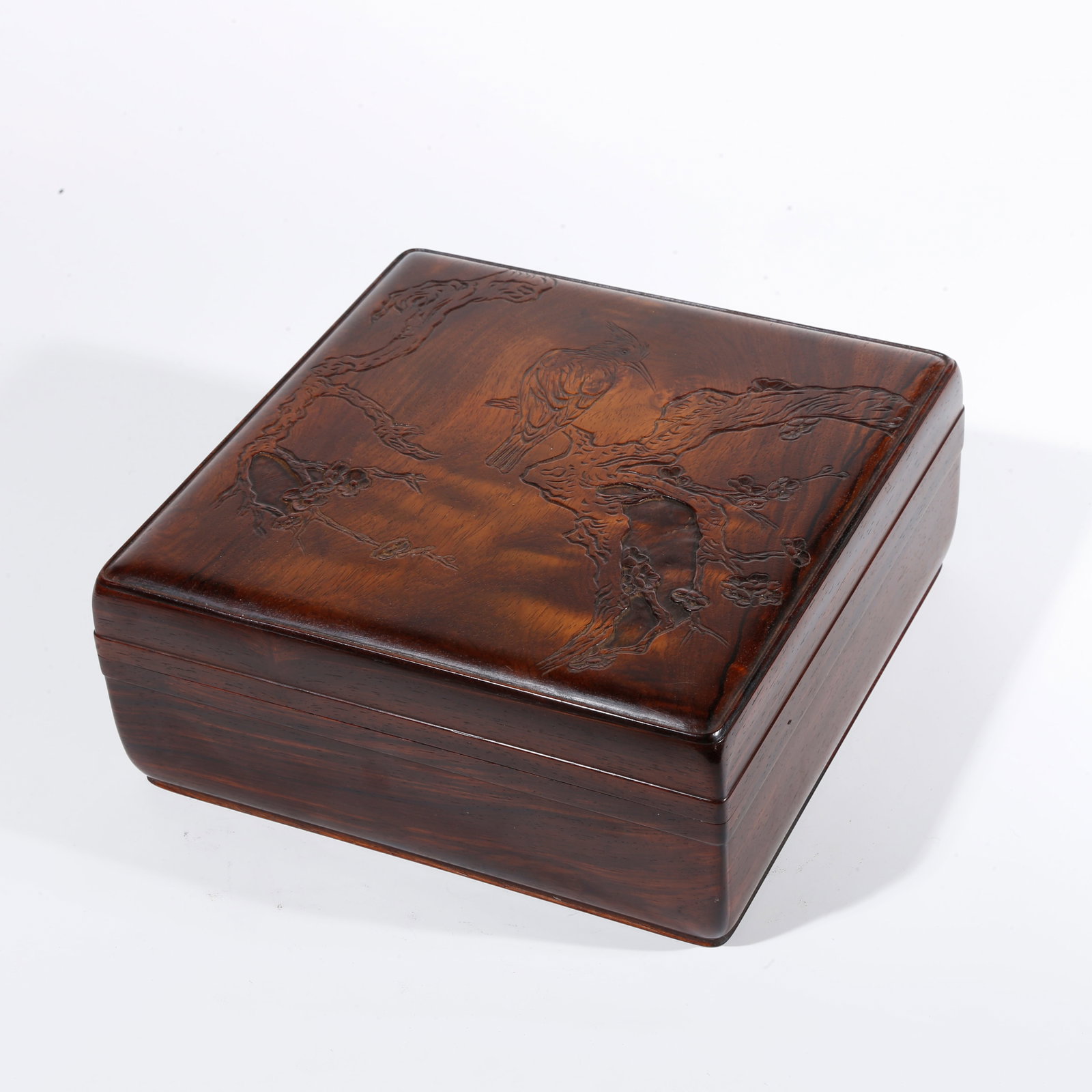 A FLOWER AND BIRD-PATTERNED COVERED BOX CARVED IN HUANGHUALI WOOD (1 of 10)